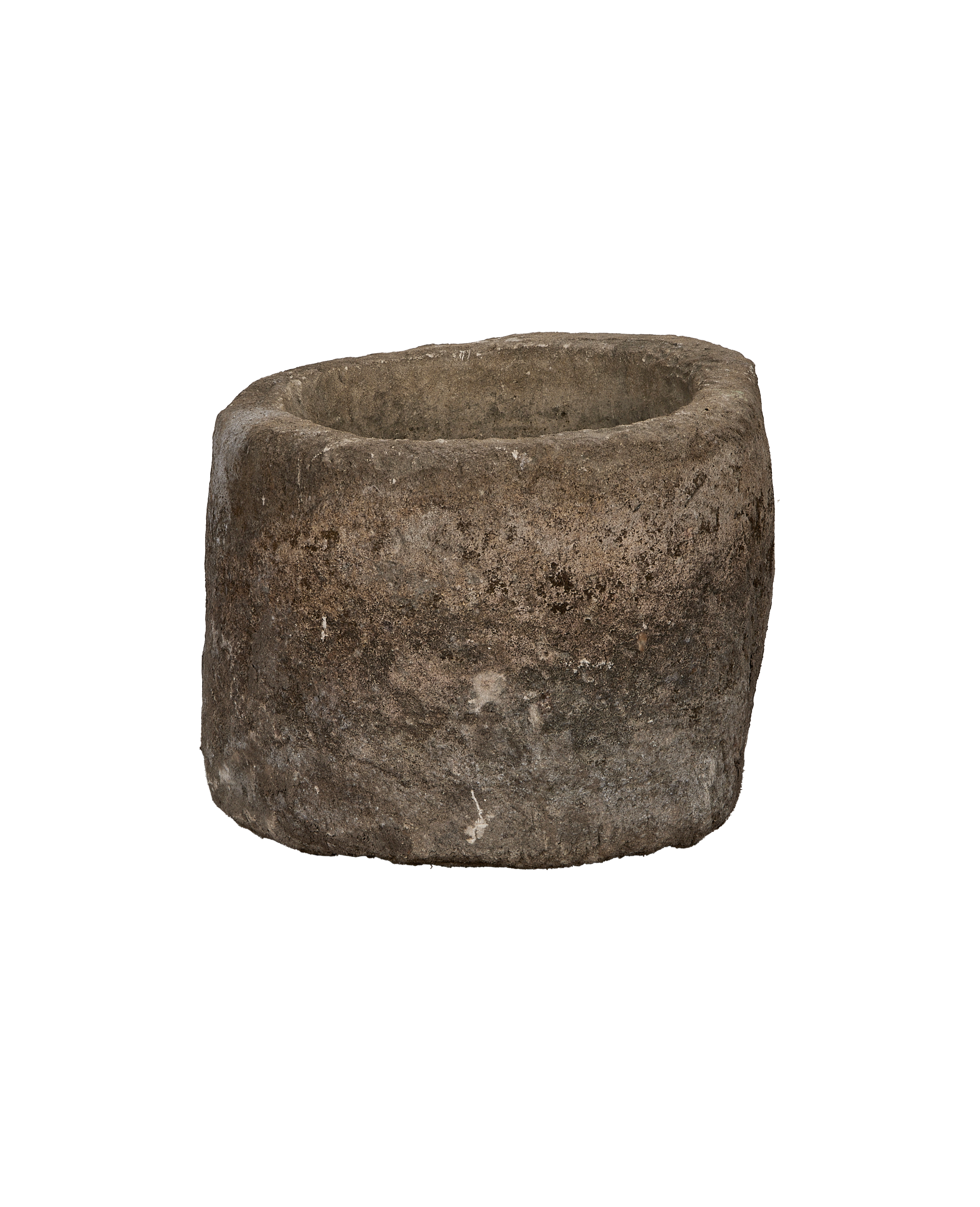 Vintage Indonesian oblong limestone trough, dark patina, showing rough exterior texture and thick wall.
