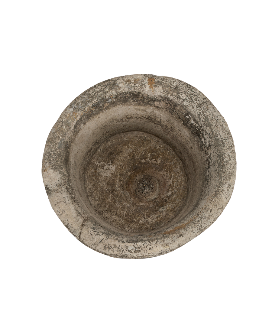 Vintage Indonesian limestone trough viewed from top, showcasing weathered, rough interior texture.
