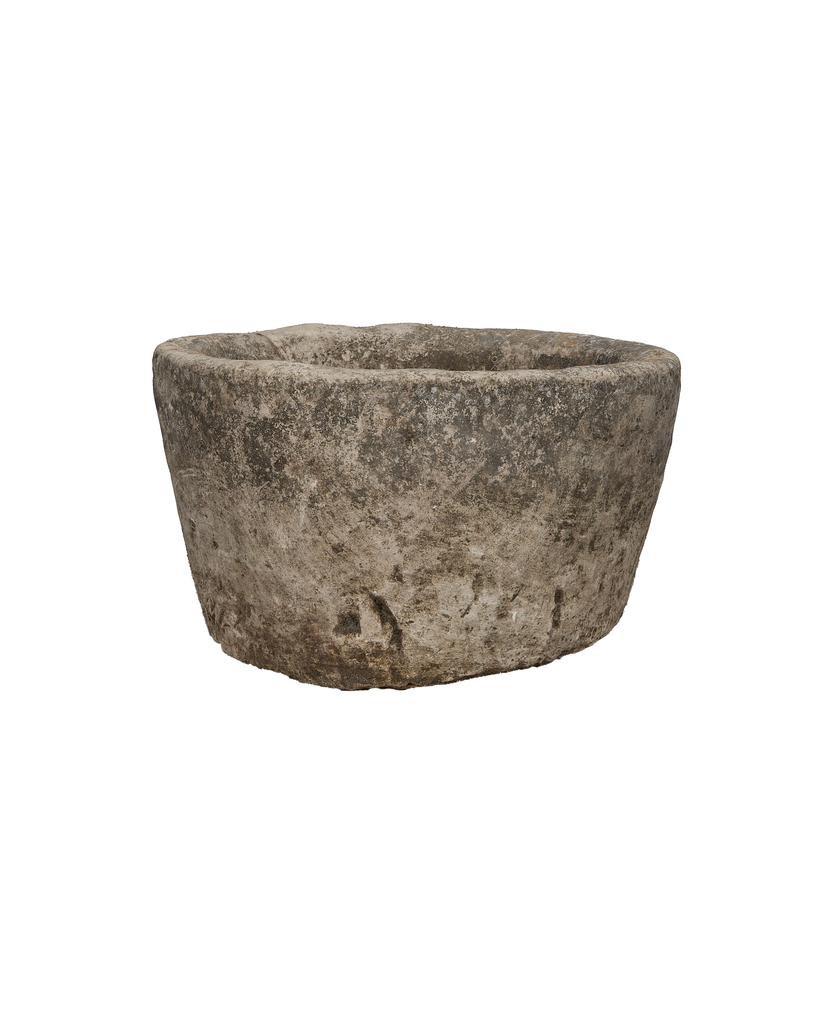Round vintage Indonesian limestone trough, showing rough exterior texture and irregular rim details.