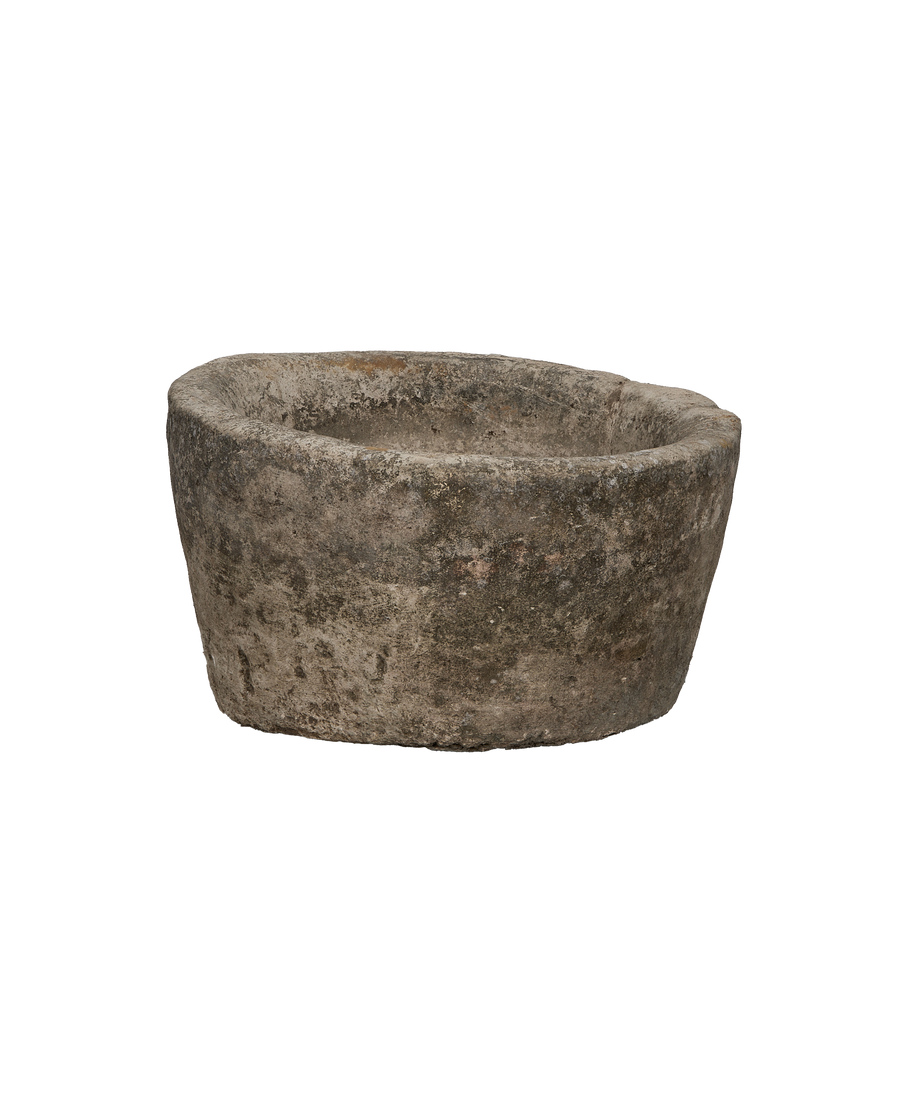 Vintage Indonesian limestone trough, round, showing detailed weathered surface texture.