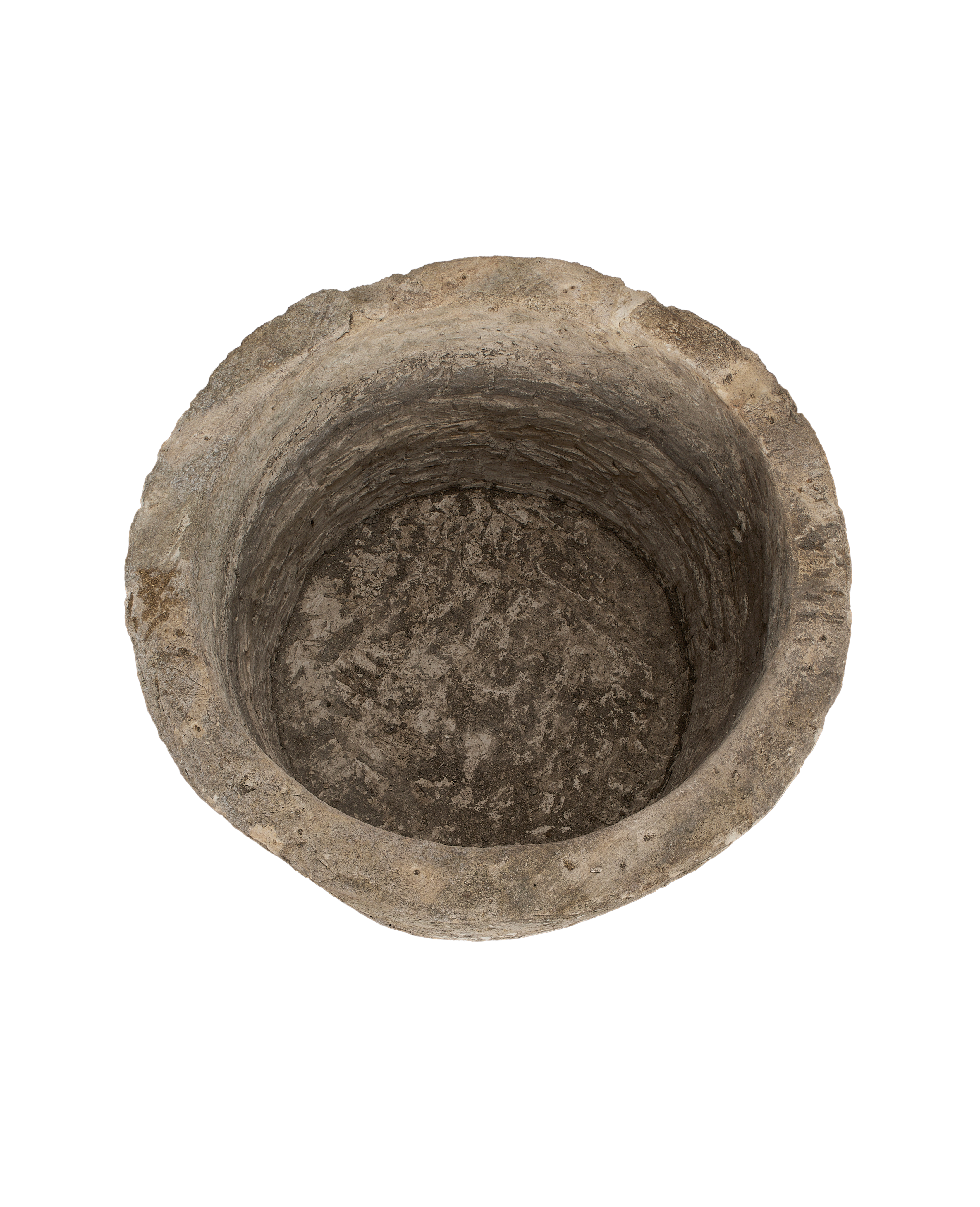 Overhead view of the vintage Indonesian round limestone trough's textured interior.