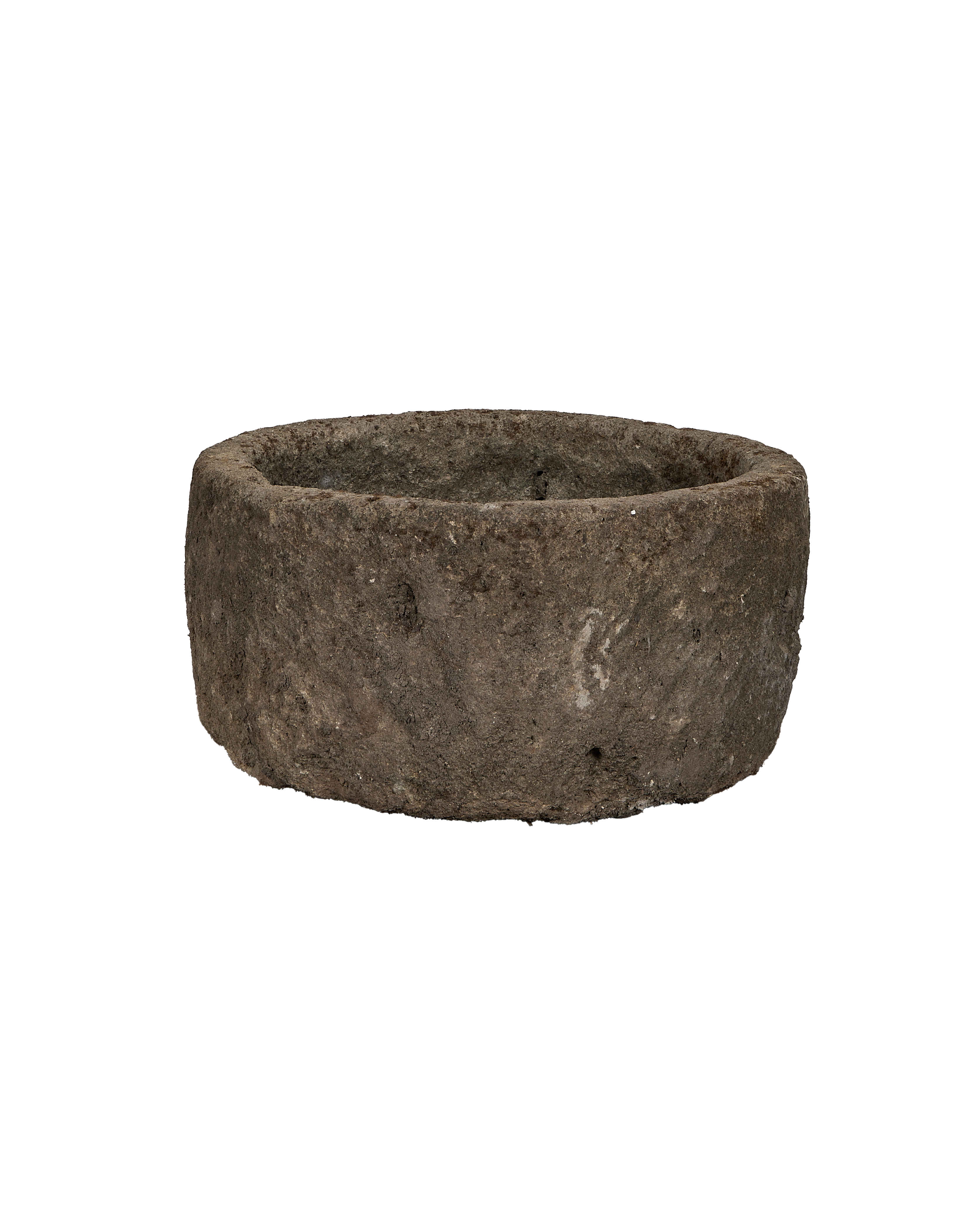 Vintage Indonesian limestone trough, displaying round shape, rough exterior texture, and weathered condition.