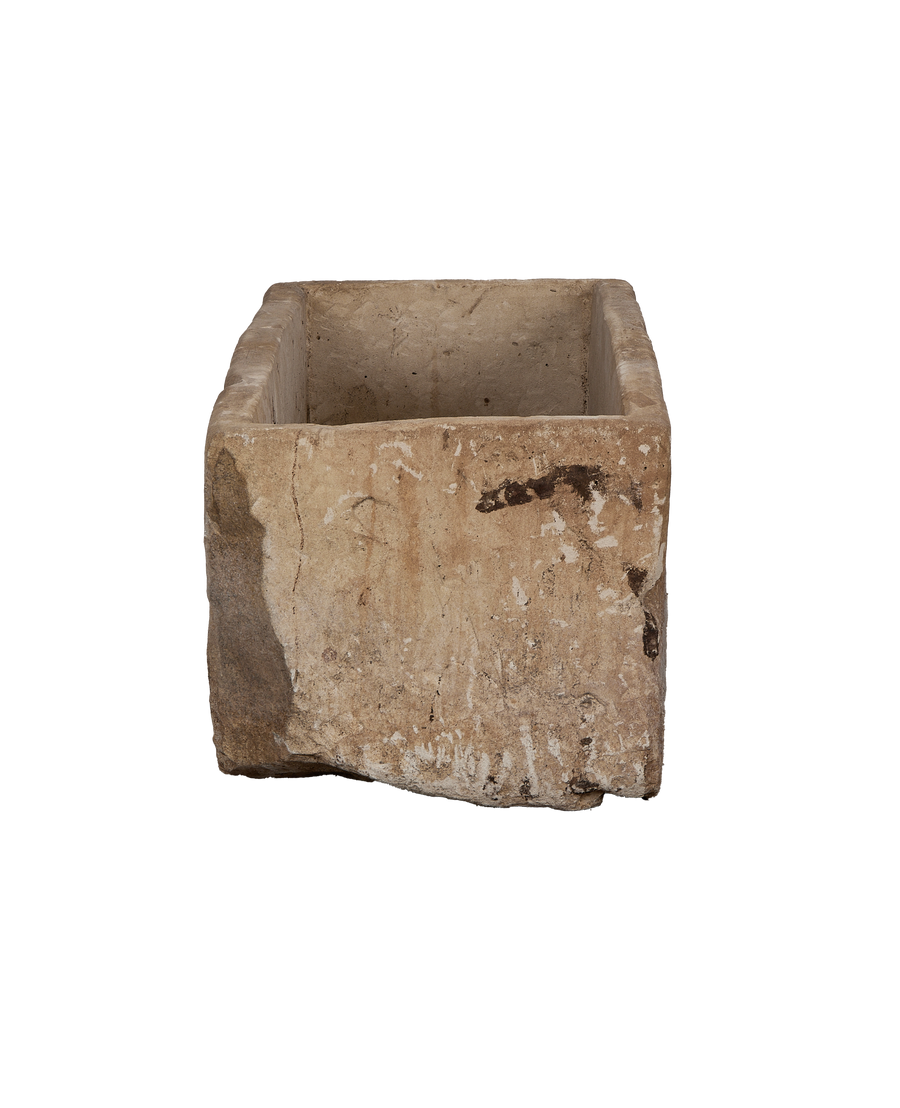 Vintage Indonesian rectangular limestone trough, wide top view showing rough edges and internal texture.