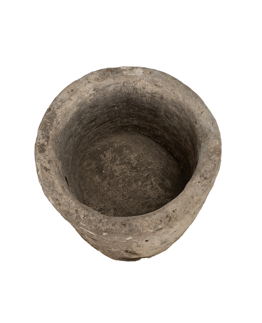 Vintage Indonesian round limestone trough, showing weathered interior surface and rustic texture.