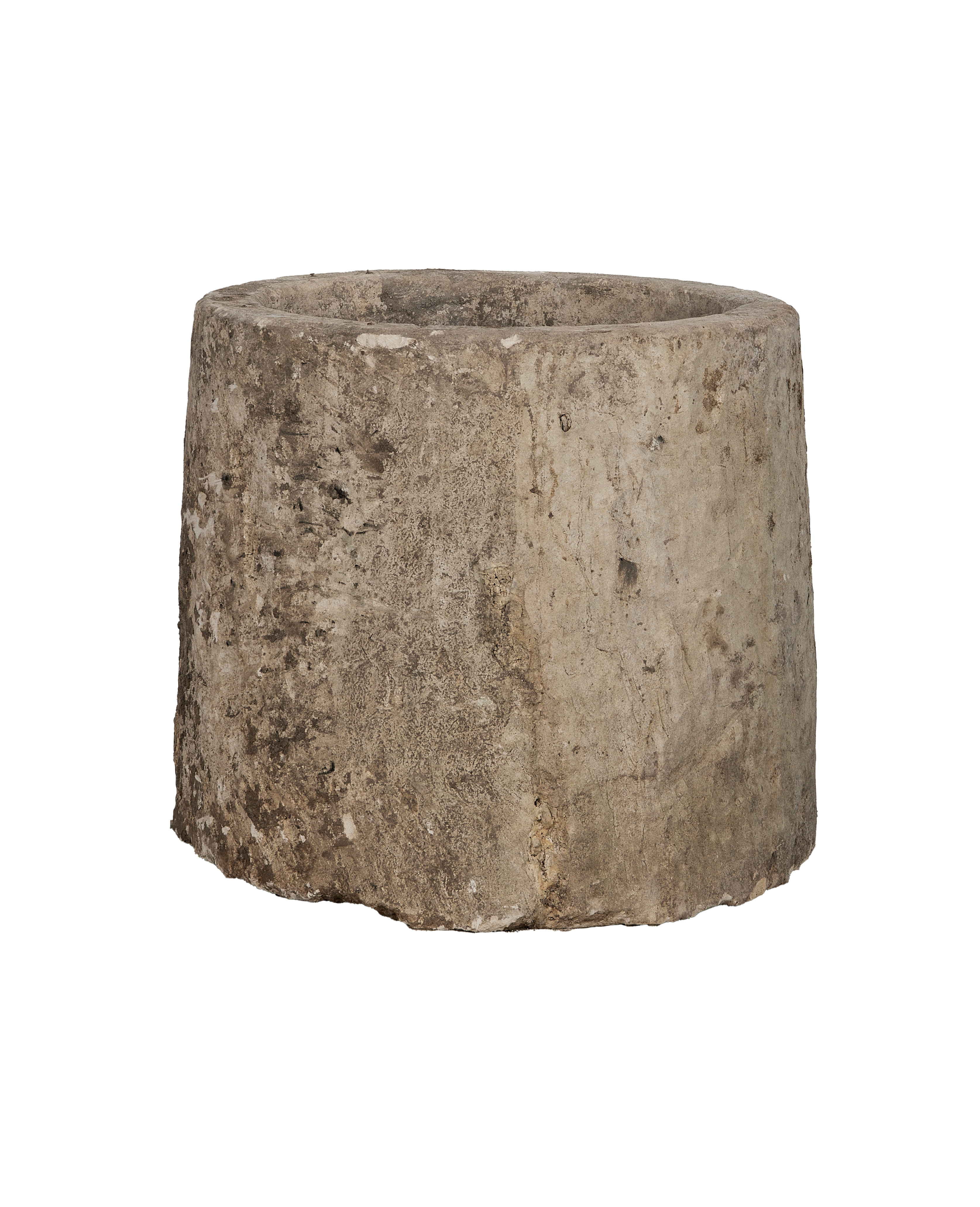Close-up showing the rustic texture and weathered surface of the vintage limestone trough.