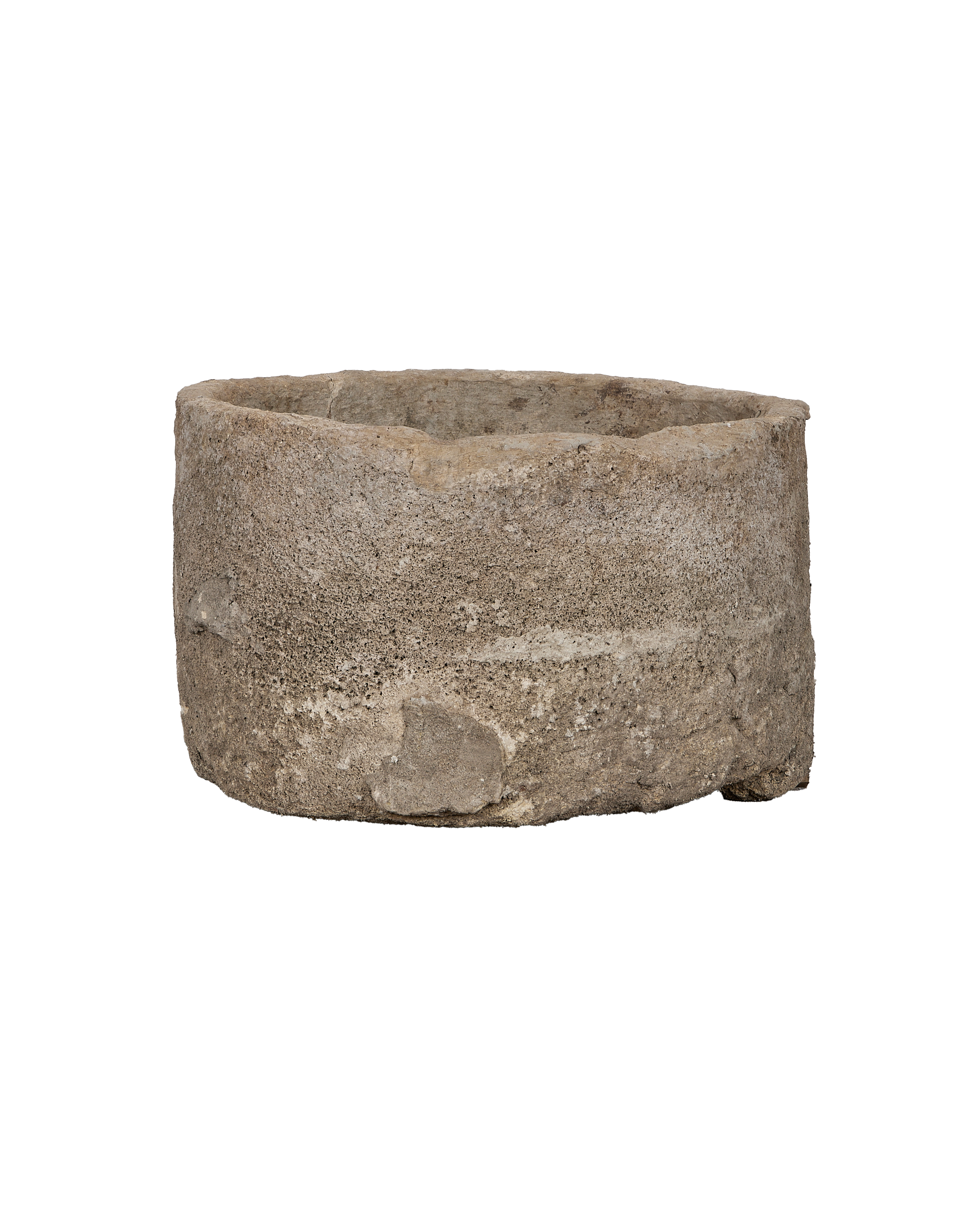 Vintage round limestone trough from Indonesia with textured, weathered natural stone.