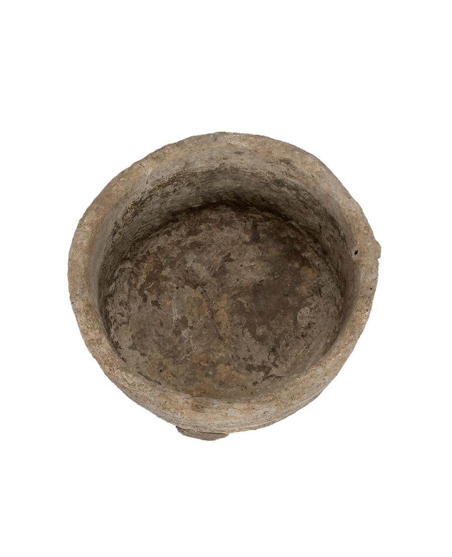 Vintage round Indonesian limestone trough, top-down view showing interior texture.