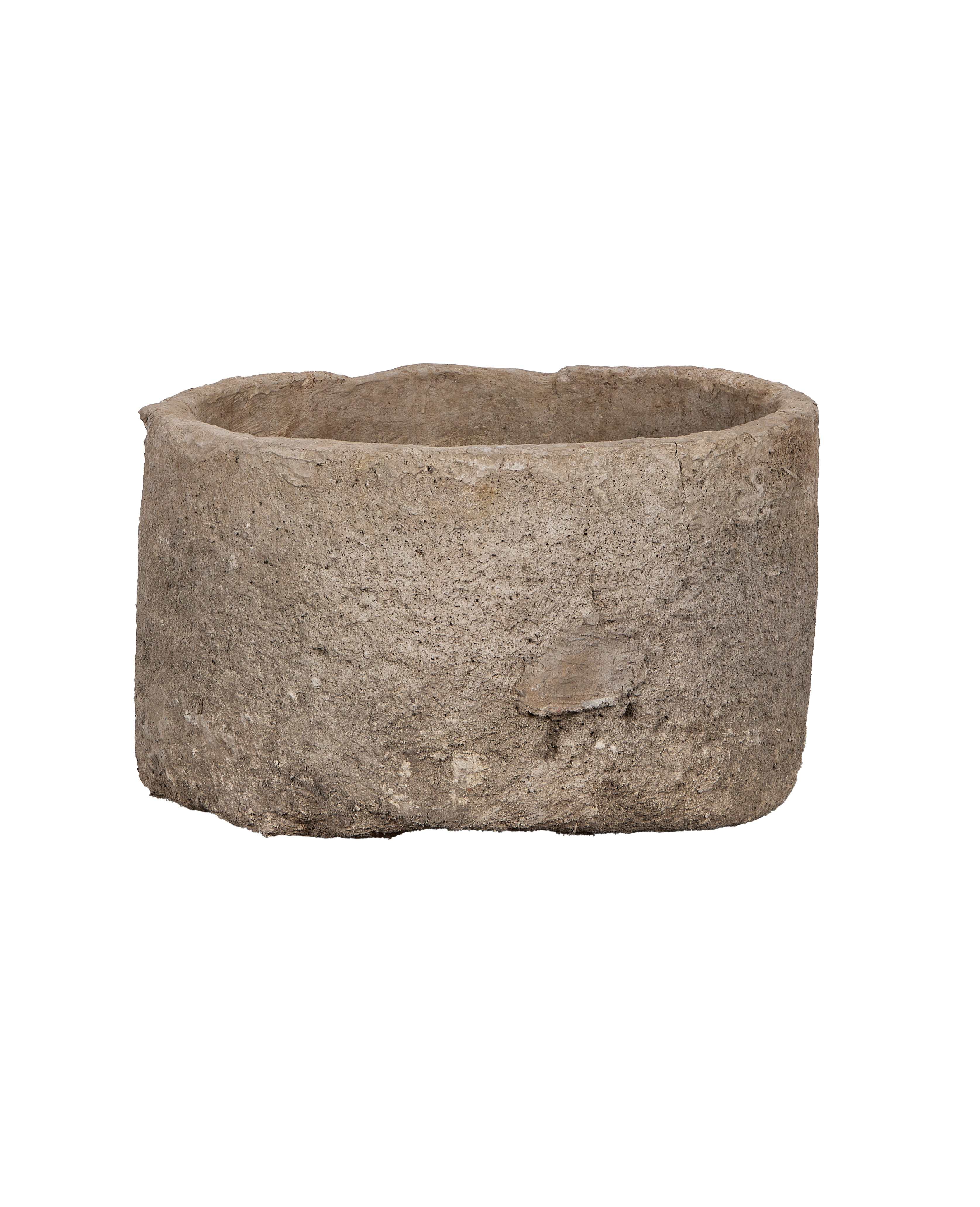 Vintage Indonesian round limestone trough, side angle showcasing raw textured surface and rough-cut edges.