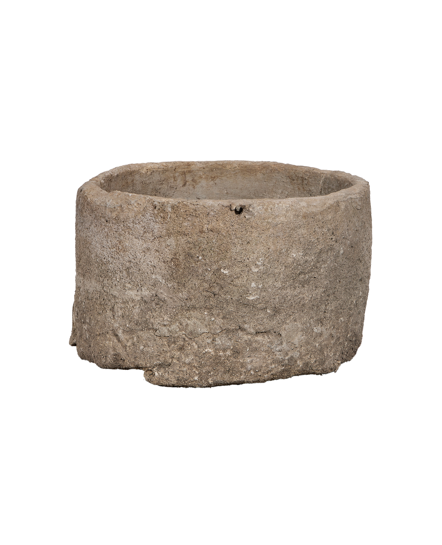 Vintage Indonesian limestone OAK trough: closeup of an irregularity with a visible hole.