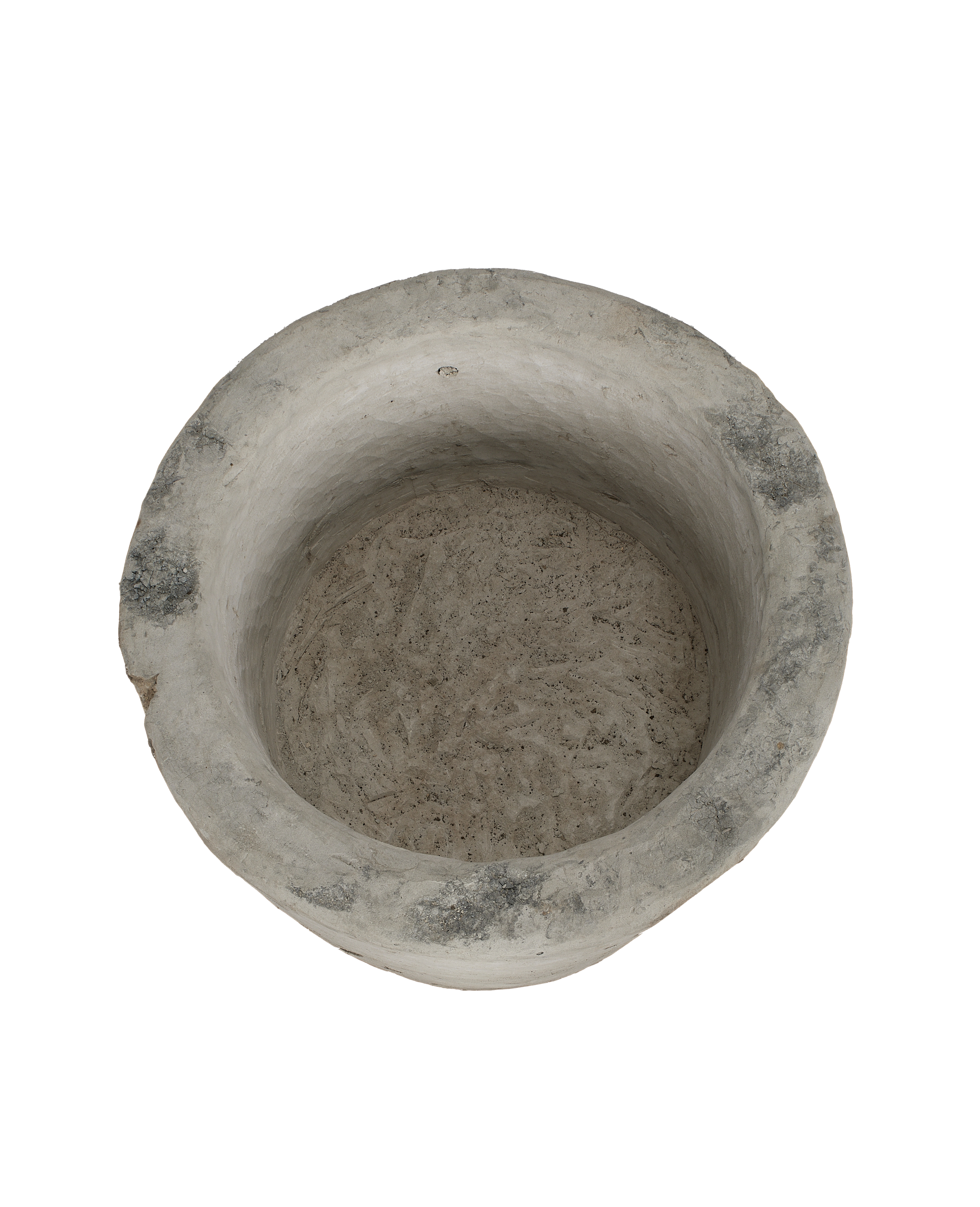 Vintage round Indonesian limestone trough, top-down view showing interior texture and rim chips.