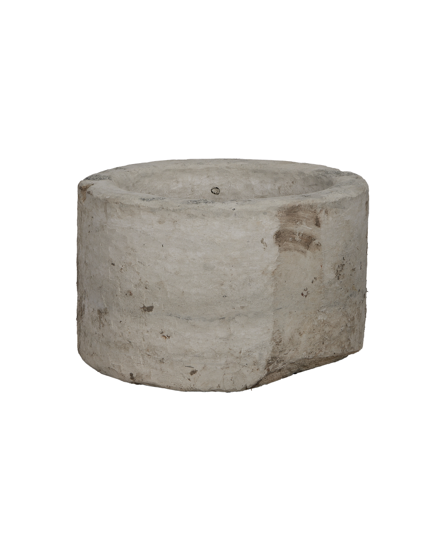 Vintage Indonesian round limestone trough, showing surface texture and patinated condition.