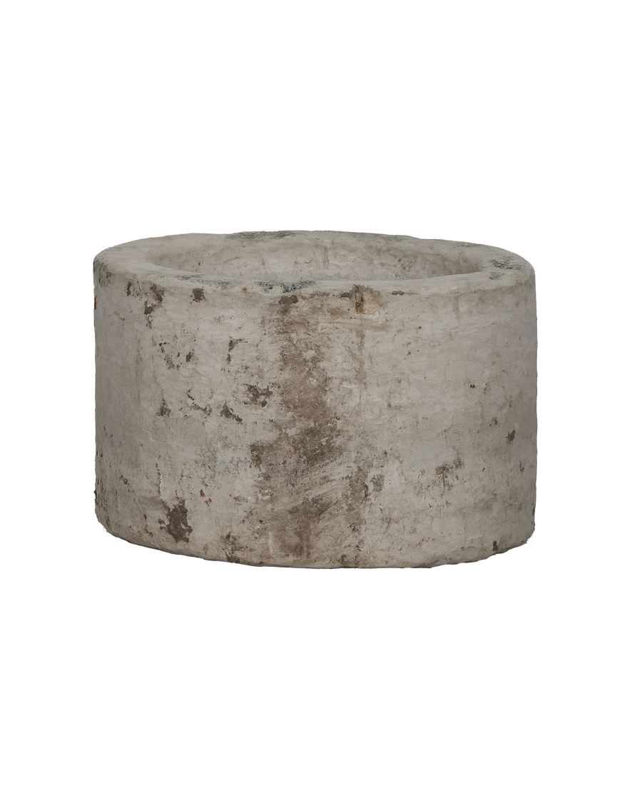 Vintage round Indonesian limestone trough, showing weathered texture and natural imperfections.