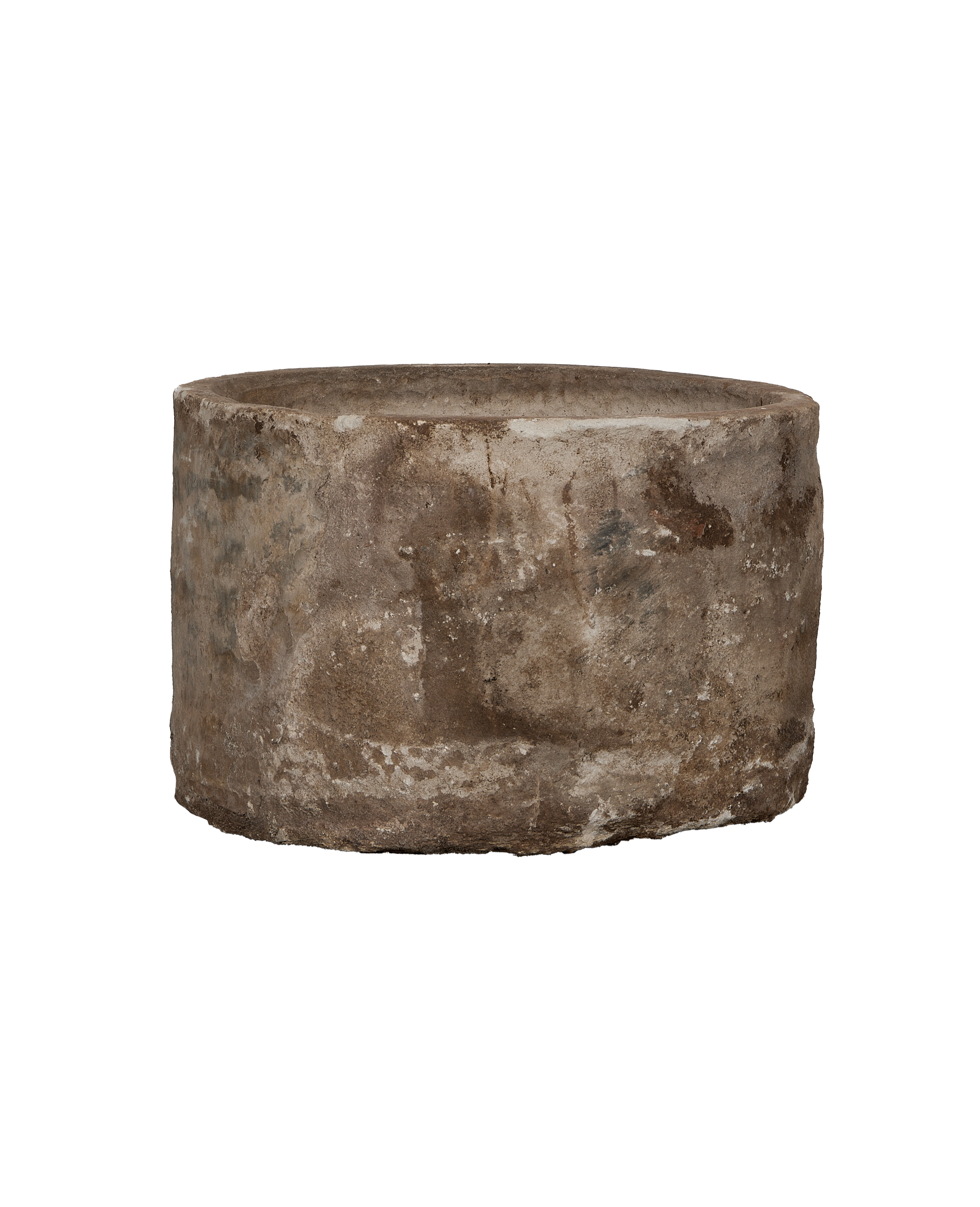 Vintage round Indonesian limestone trough showing weathered surface texture and patina.
