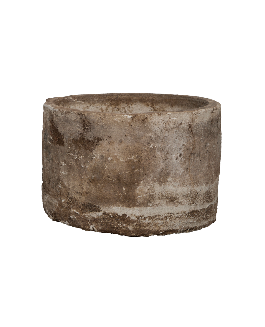 Vintage Indonesian round limestone trough, subtle weathering and texture detail from an elevated side view.