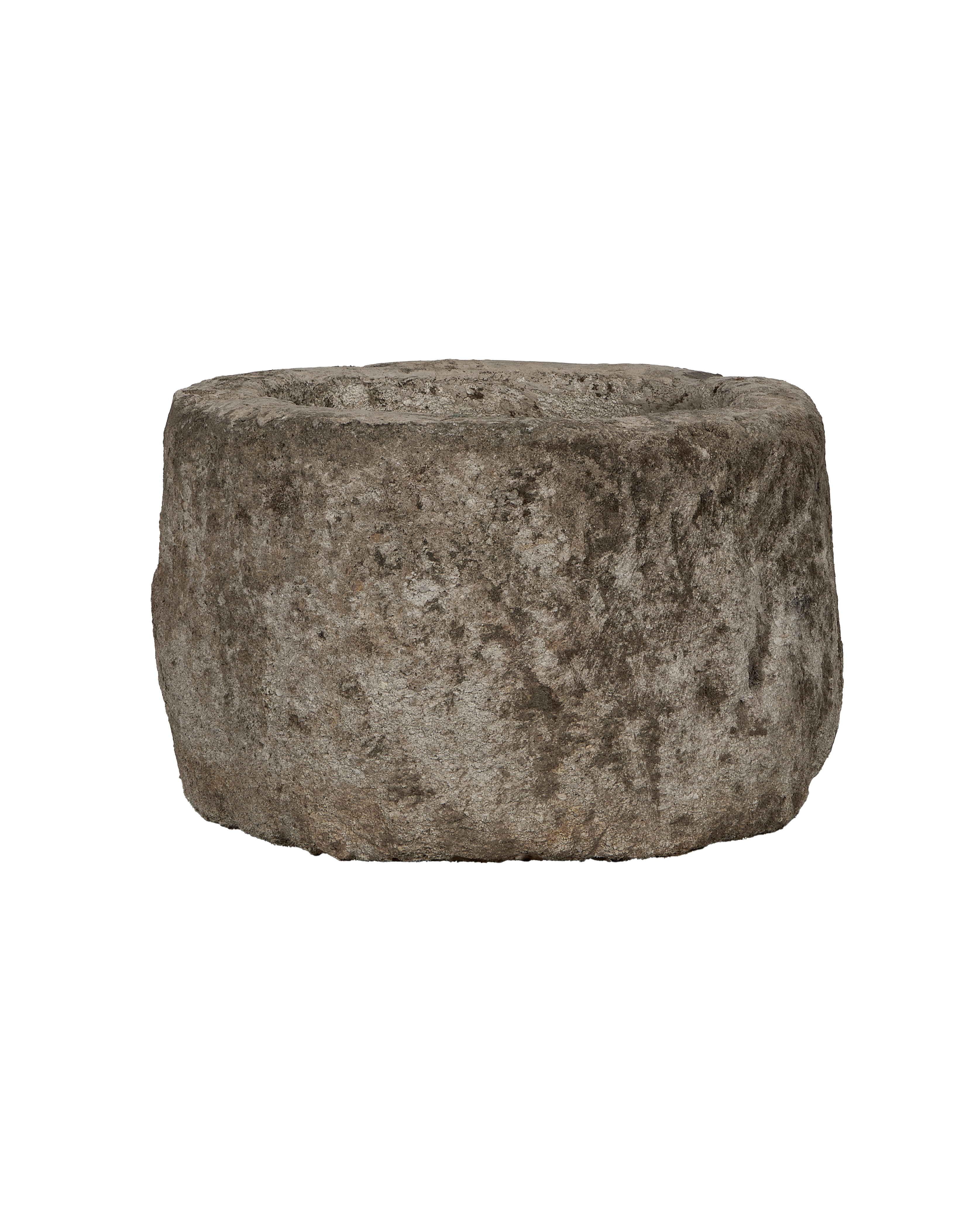 Vintage Indonesian round limestone trough, rough texture, side view.