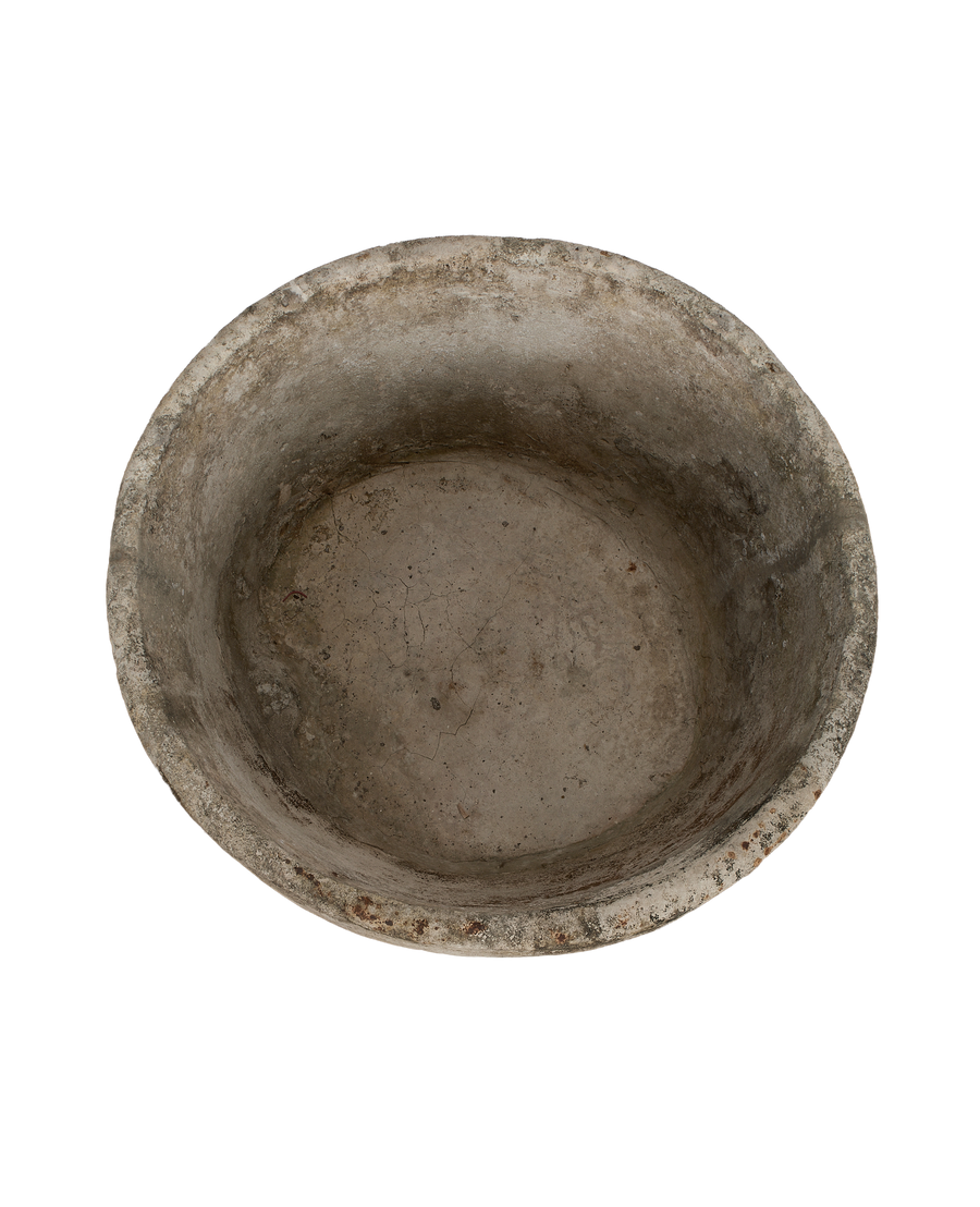Vintage Indonesian round limestone trough, top view showing weathered texture and cracks.
