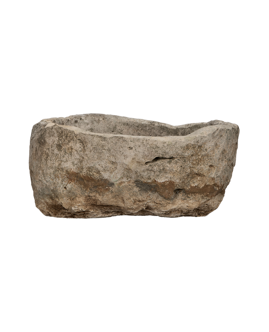 Vintage Indonesian oblong limestone trough, front-facing view showcasing rough, textured surface and aged patination.