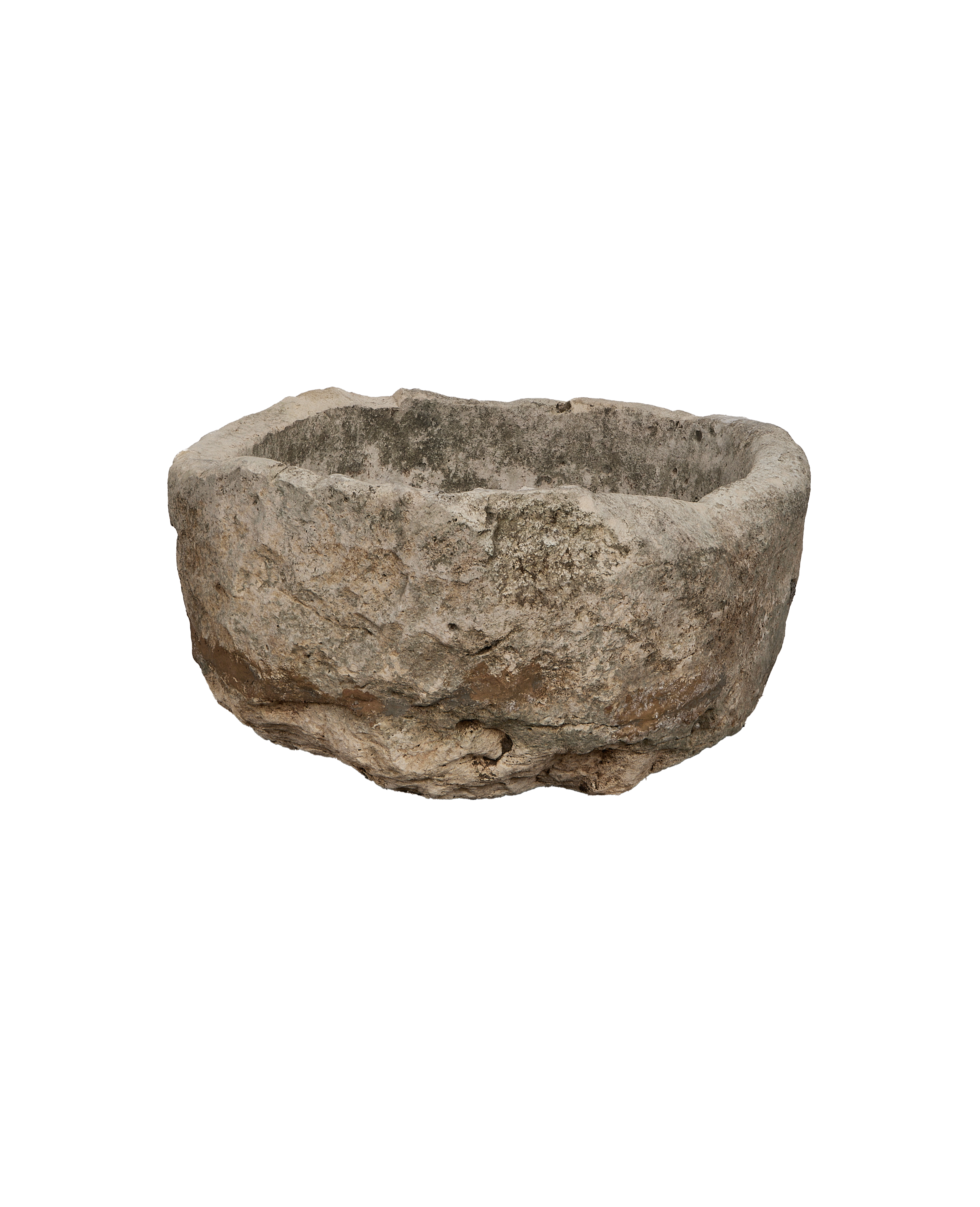 Vintage Indonesian oblong limestone trough, dark patina, showing rough, weathered stone texture.