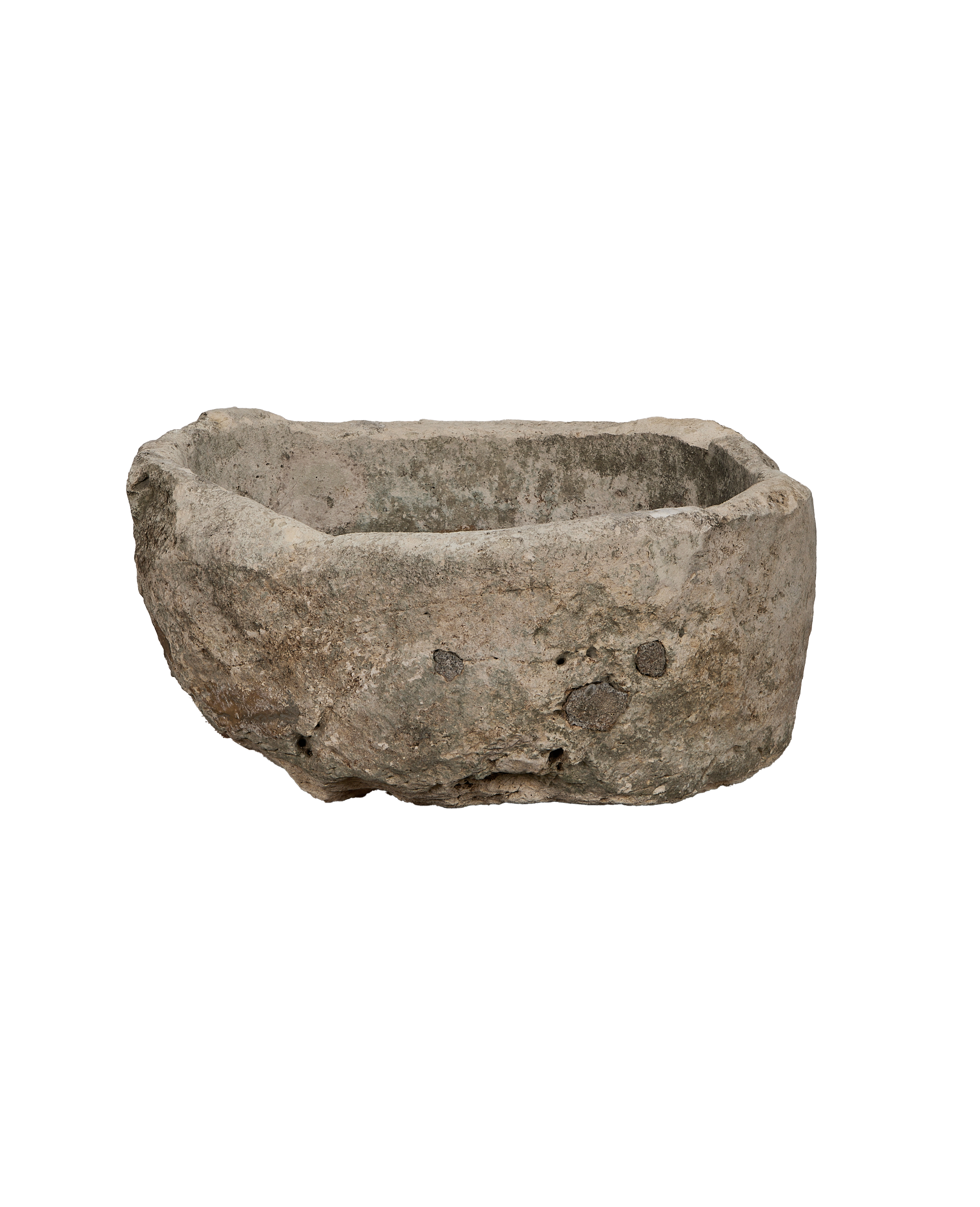 Vintage Indonesian oblong limestone trough, detailed texture and rough-hewn edges, high angle view.