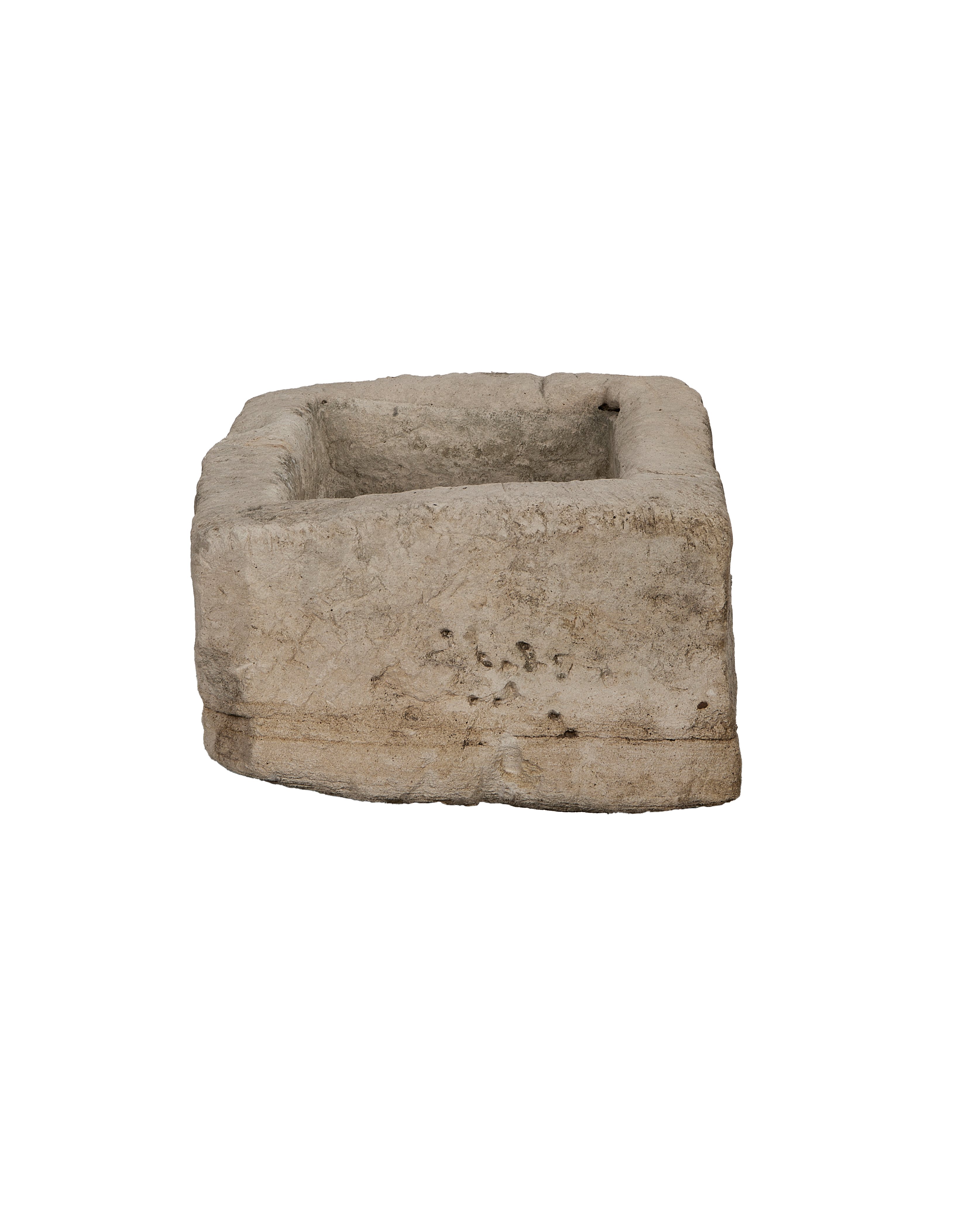 Vintage Indonesian limestone trough, rectangular, revealing textured surface and worn bottom edge.
