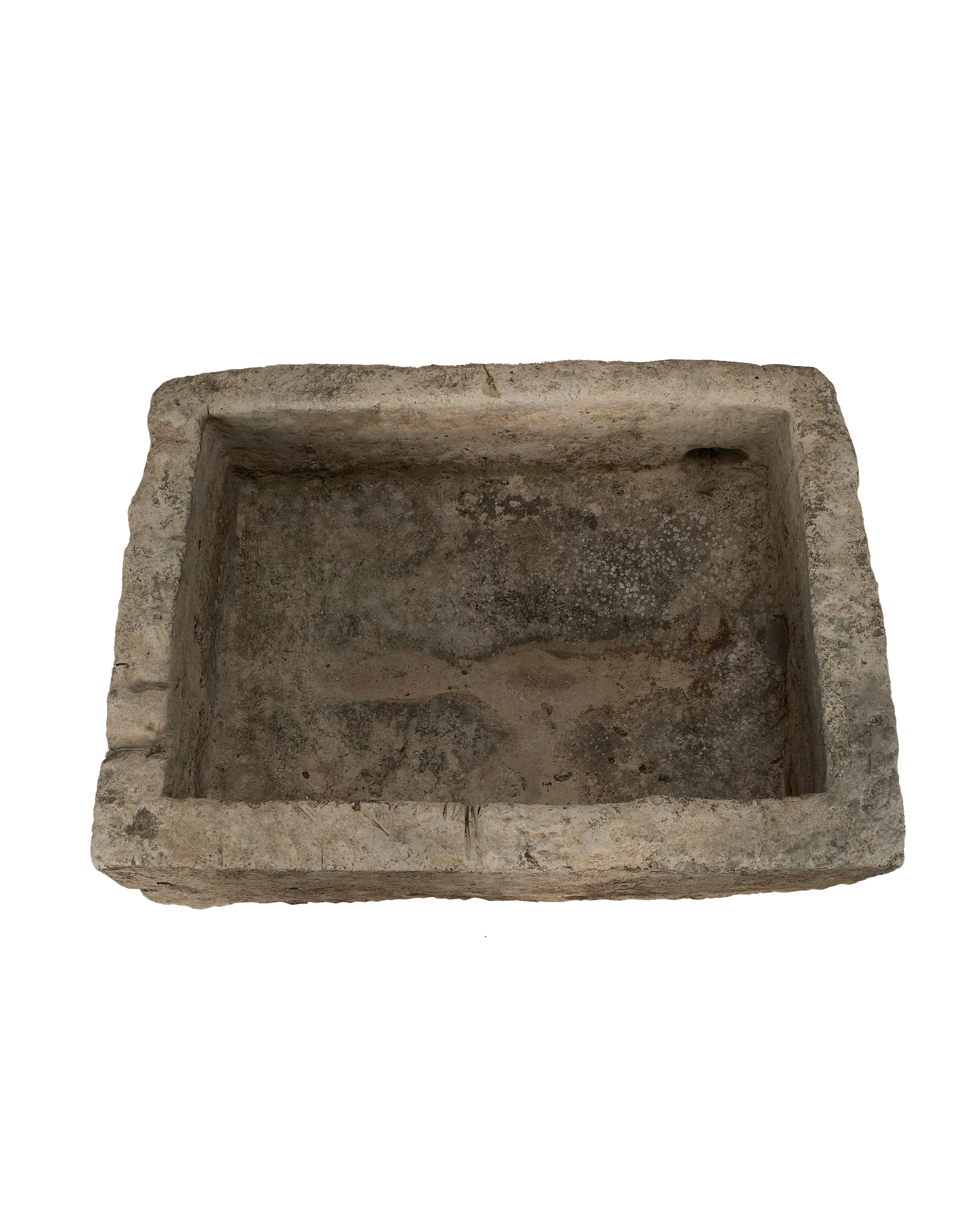 Vintage Indonesian limestone trough, top-down view showing deep rectangular basin and rough inner texture.