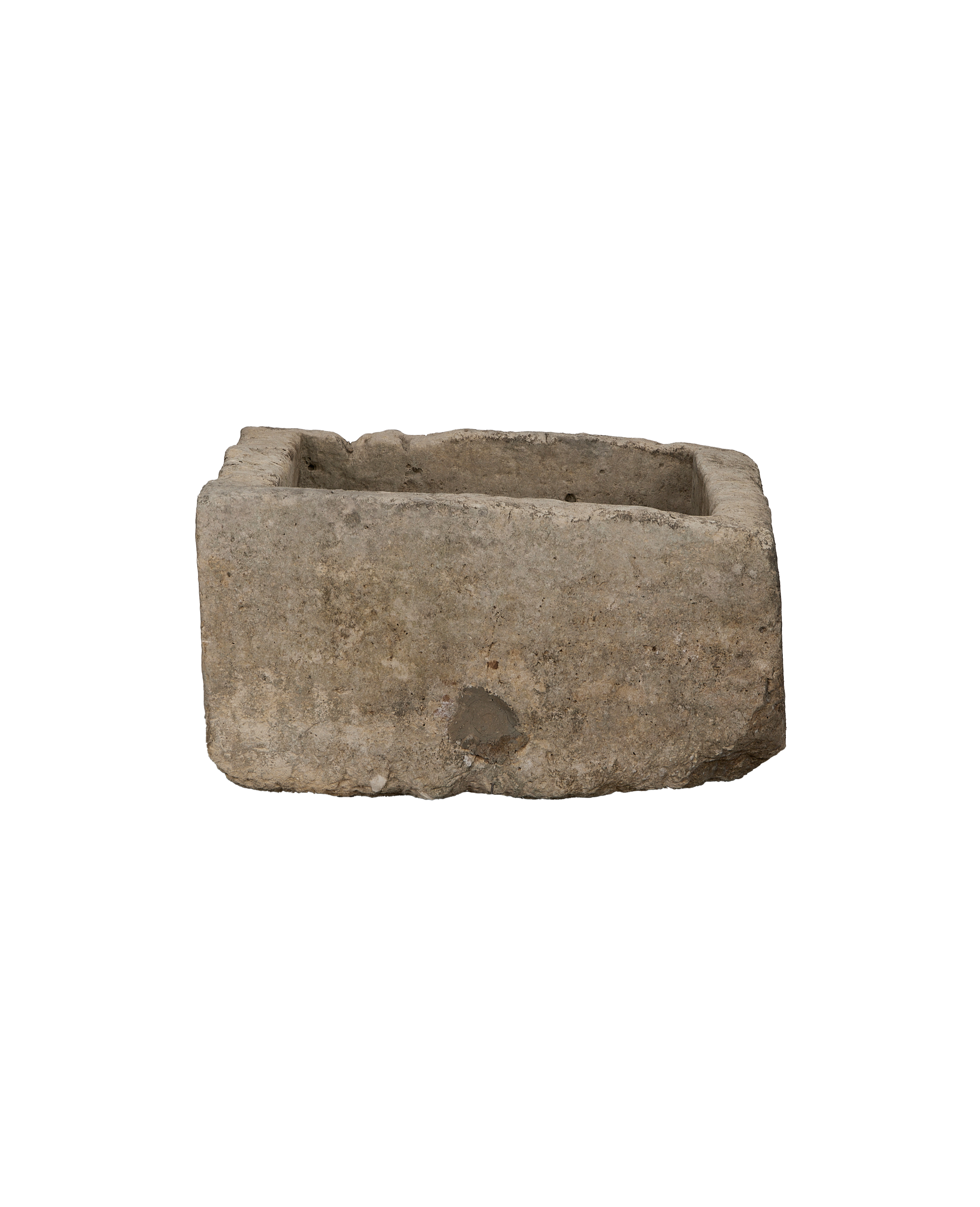 Vintage Indonesian limestone trough, rectangular, from a low-angle showing its weathered texture.