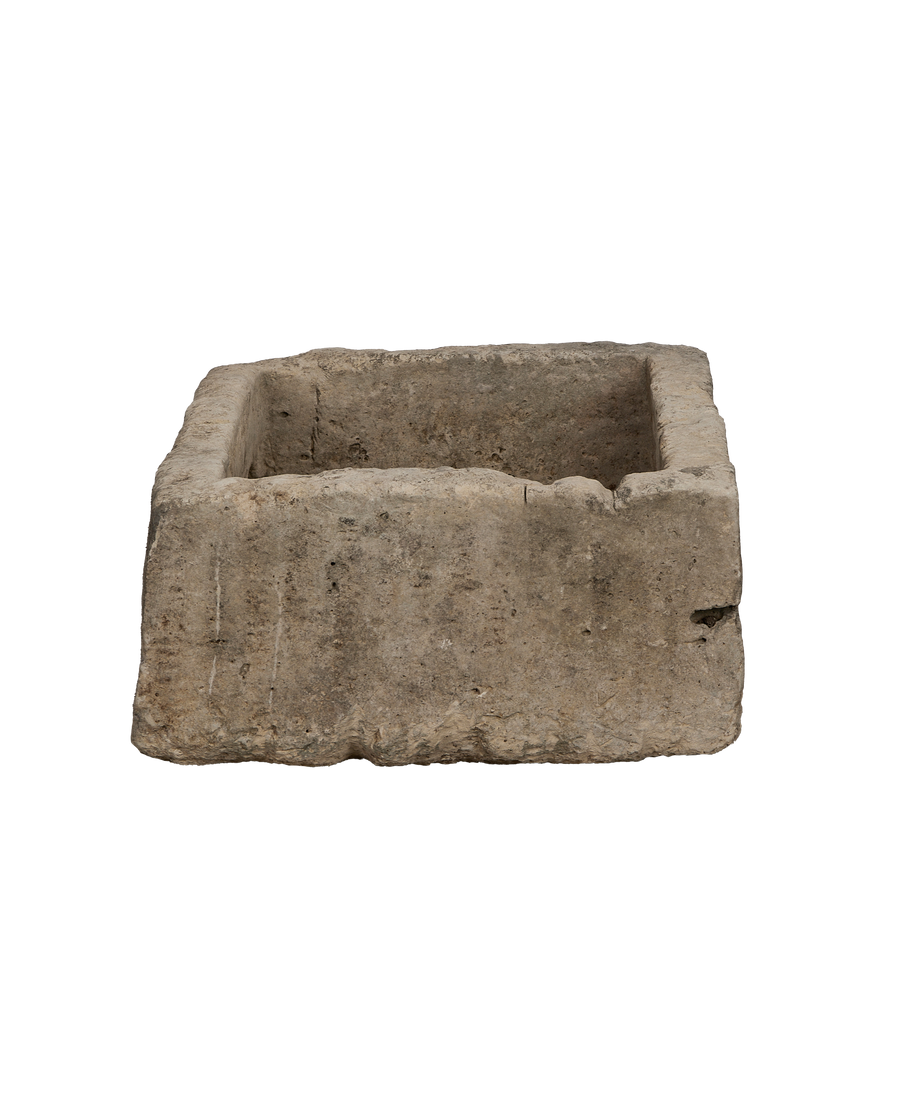 Vintage Indonesian rectangular limestone trough, detailed rough-hewn exterior texture, top-down view.