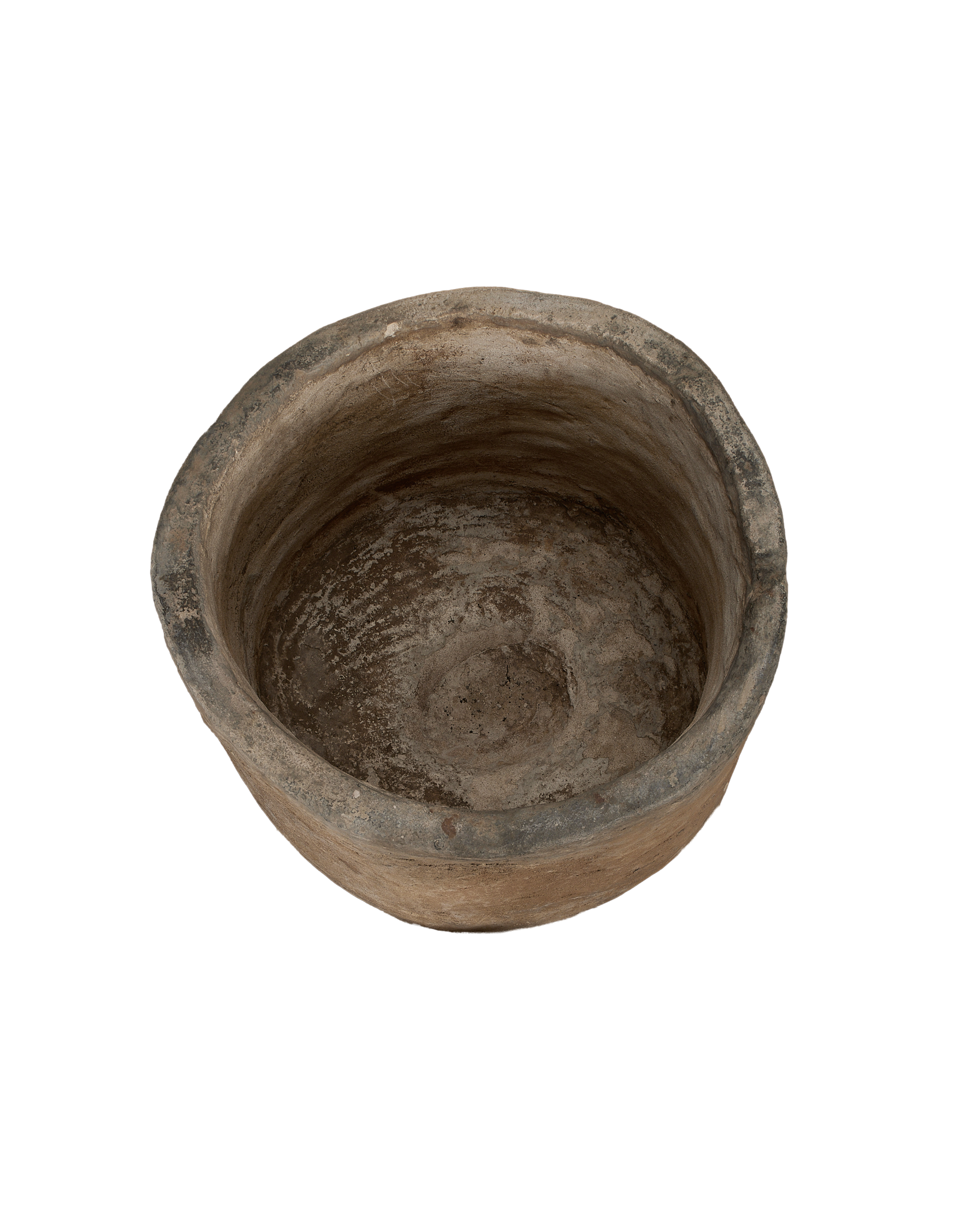 Vintage Indonesian round limestone trough, top-down view showing weathered interior texture and age.
