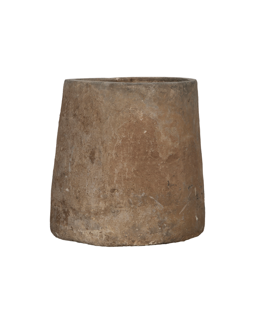 Vintage limestone trough, round, showcasing worn condition and weathered patina from a side angle.