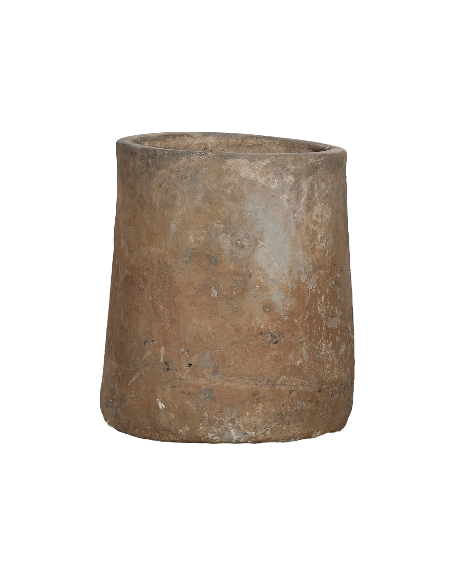 Vintage Indonesian round limestone trough, showing weathered texture on side and rim.