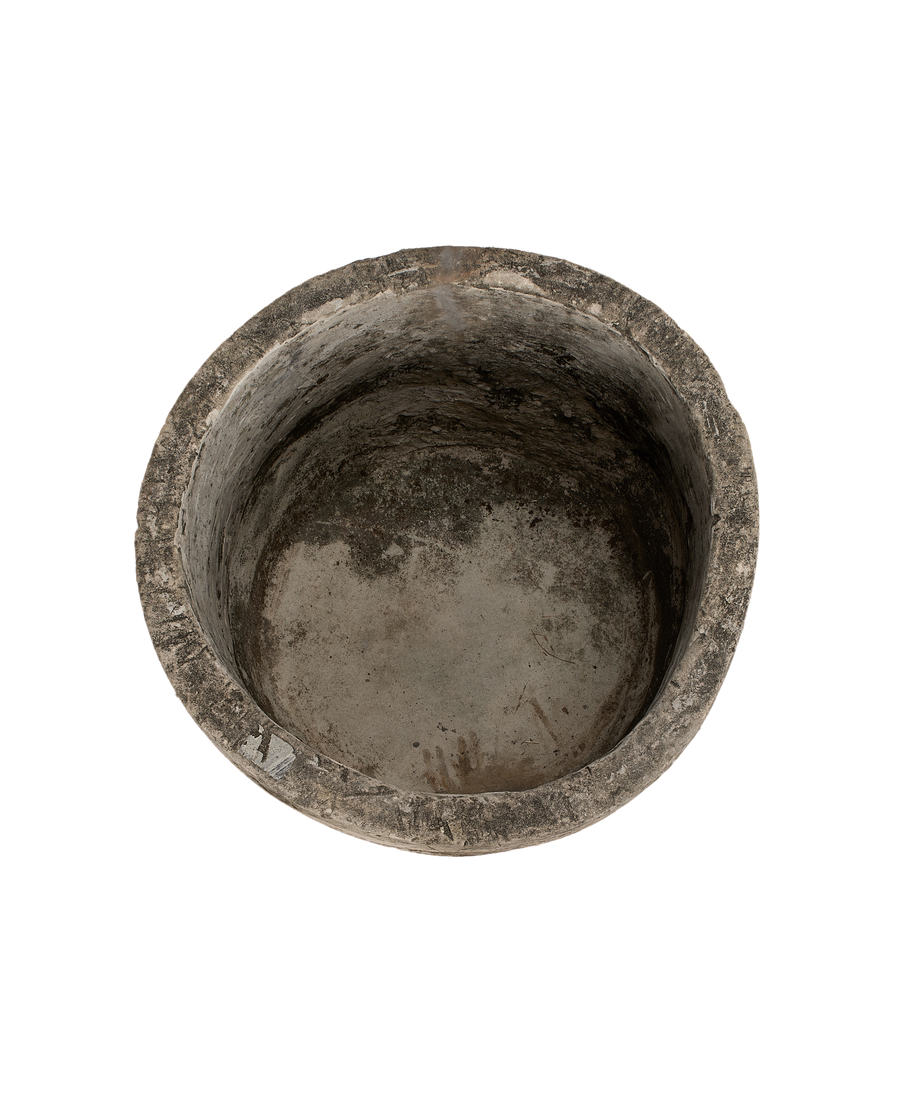 Vintage Indonesian OAK limestone trough, round, showing worn interior texture and patina.
