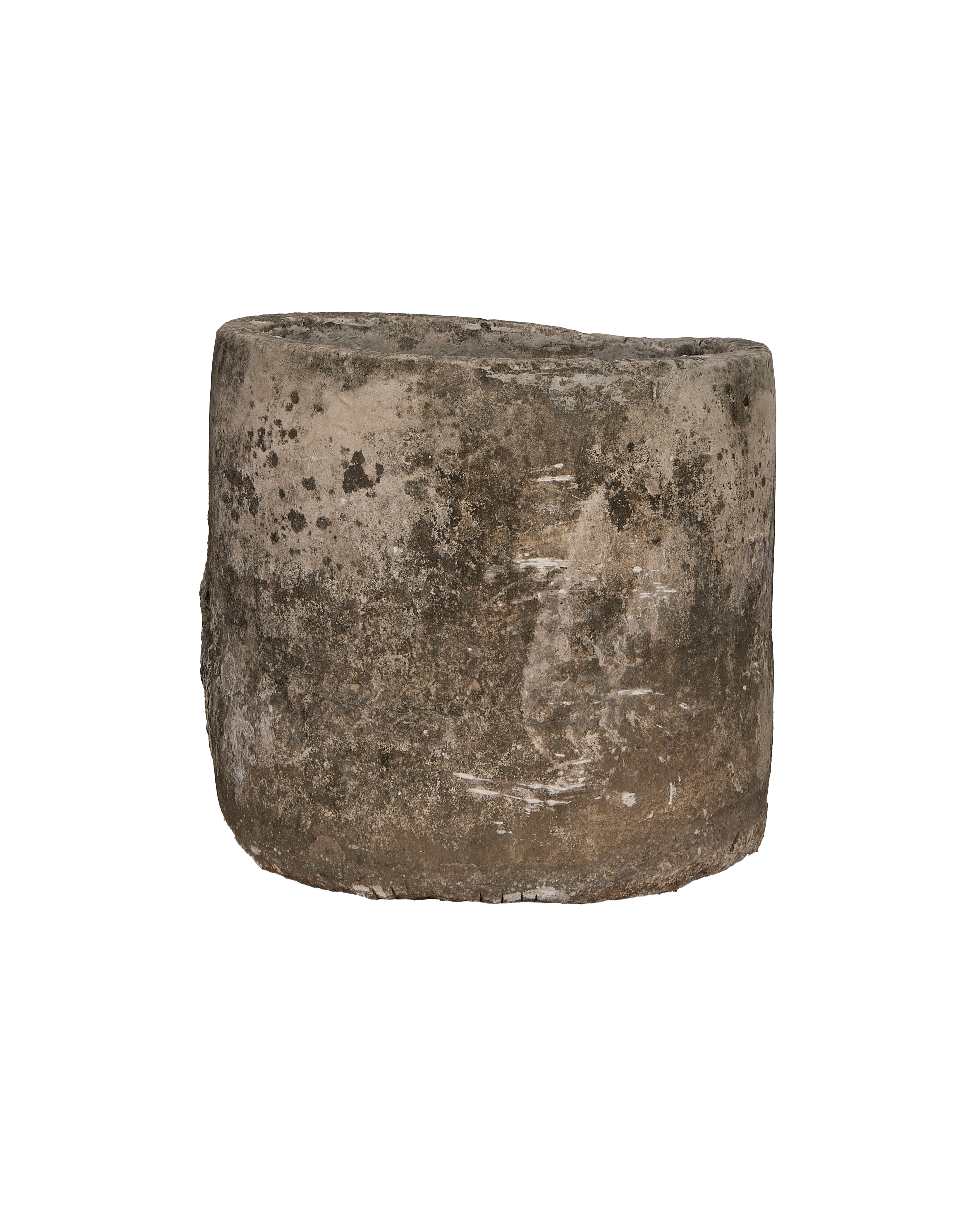 Vintage Indonesian limestone trough closeup, featuring rough texture and weathering on its round sides.