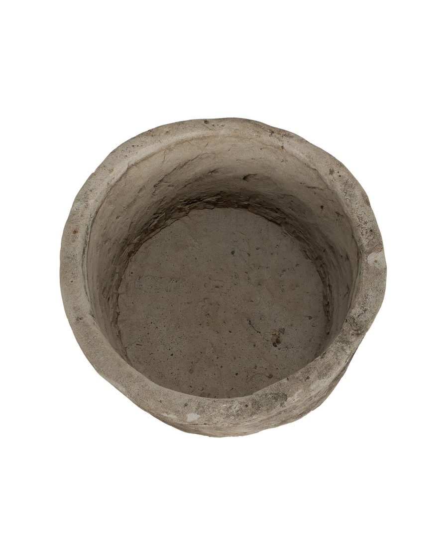 Vintage Indonesian limestone trough, top-down view showing interior circular texture.