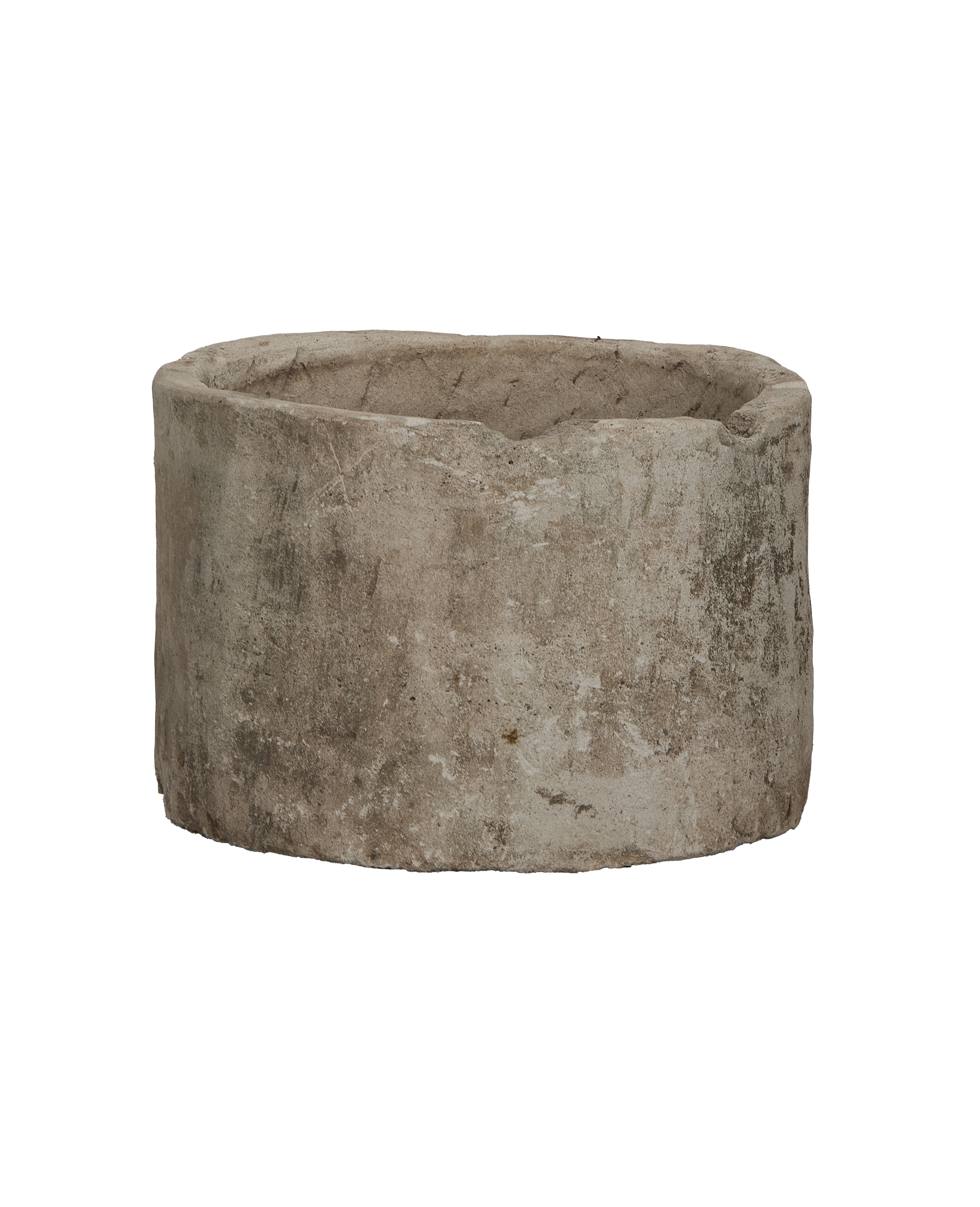 Vintage round limestone trough from Indonesia with distressed, weathered texture on black.
