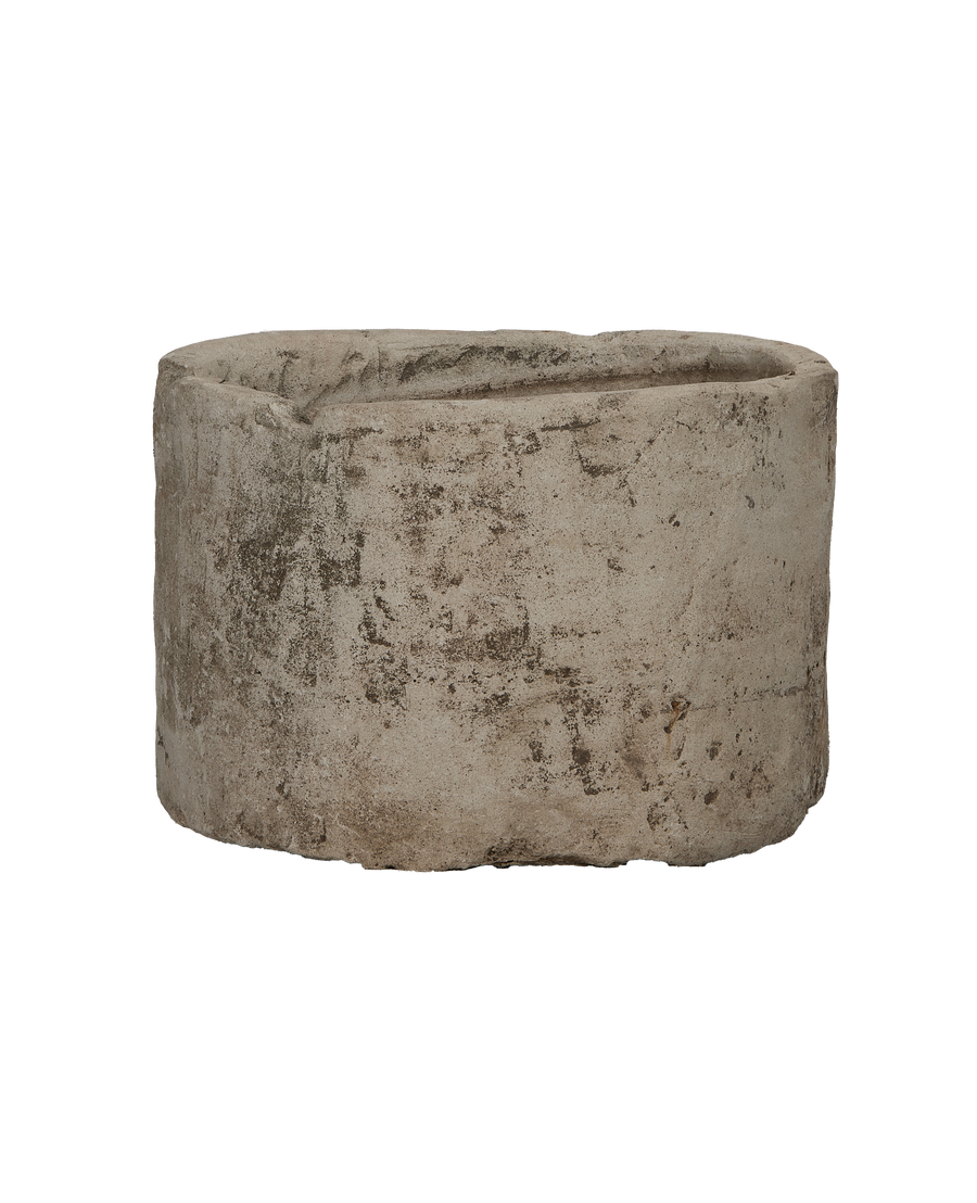 Vintage Indonesian limestone trough (OAK model) showing weathered texture and round form.