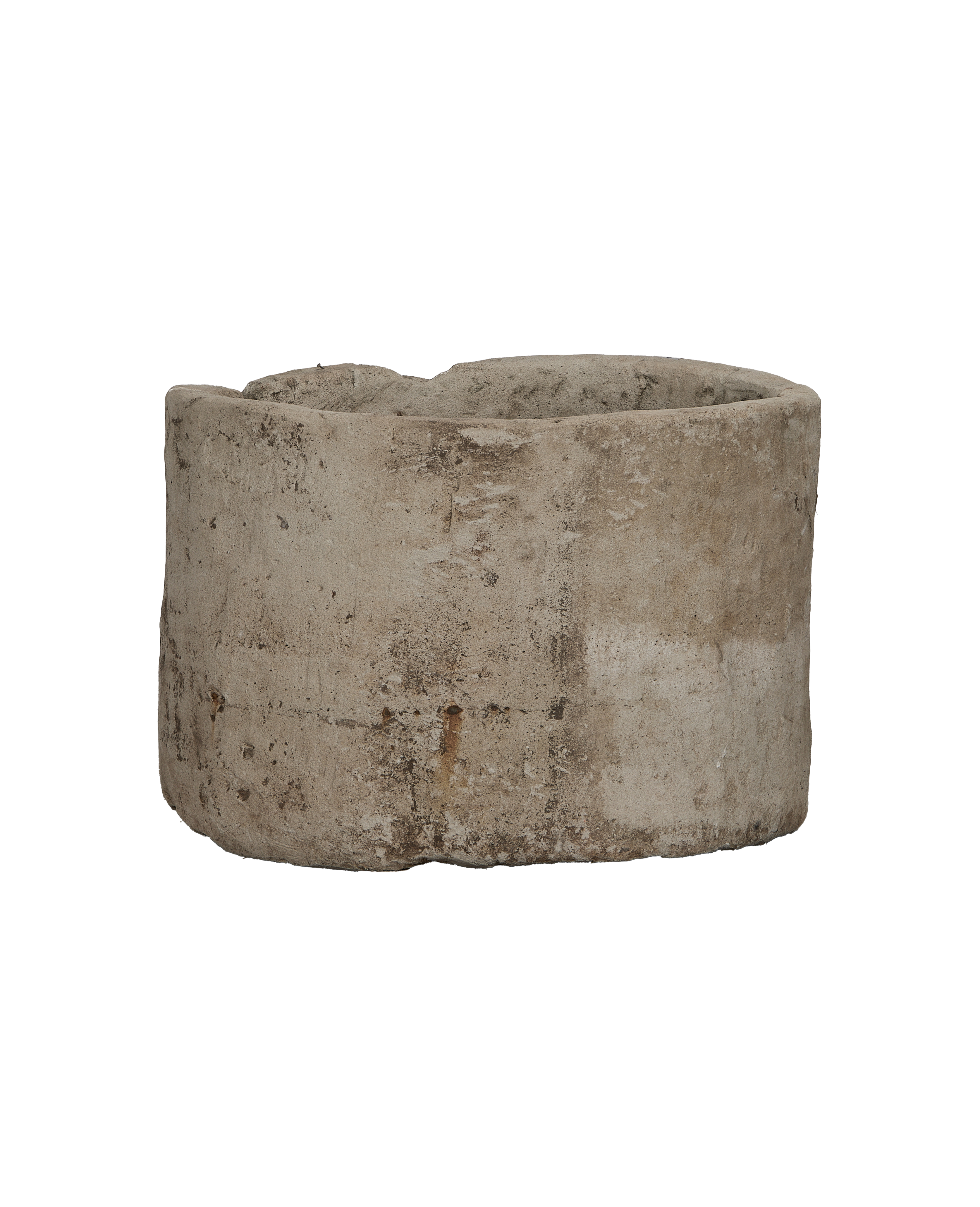 Vintage Indonesian limestone trough, round antique planter, showing rugged exterior with weathered texture.