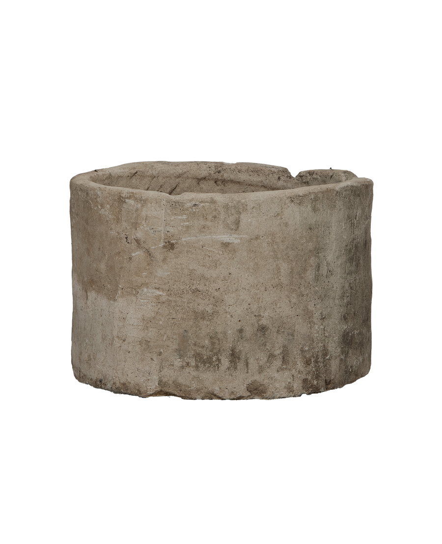 Vintage round Indonesian limestone trough, showing surface texture and weathered patina.