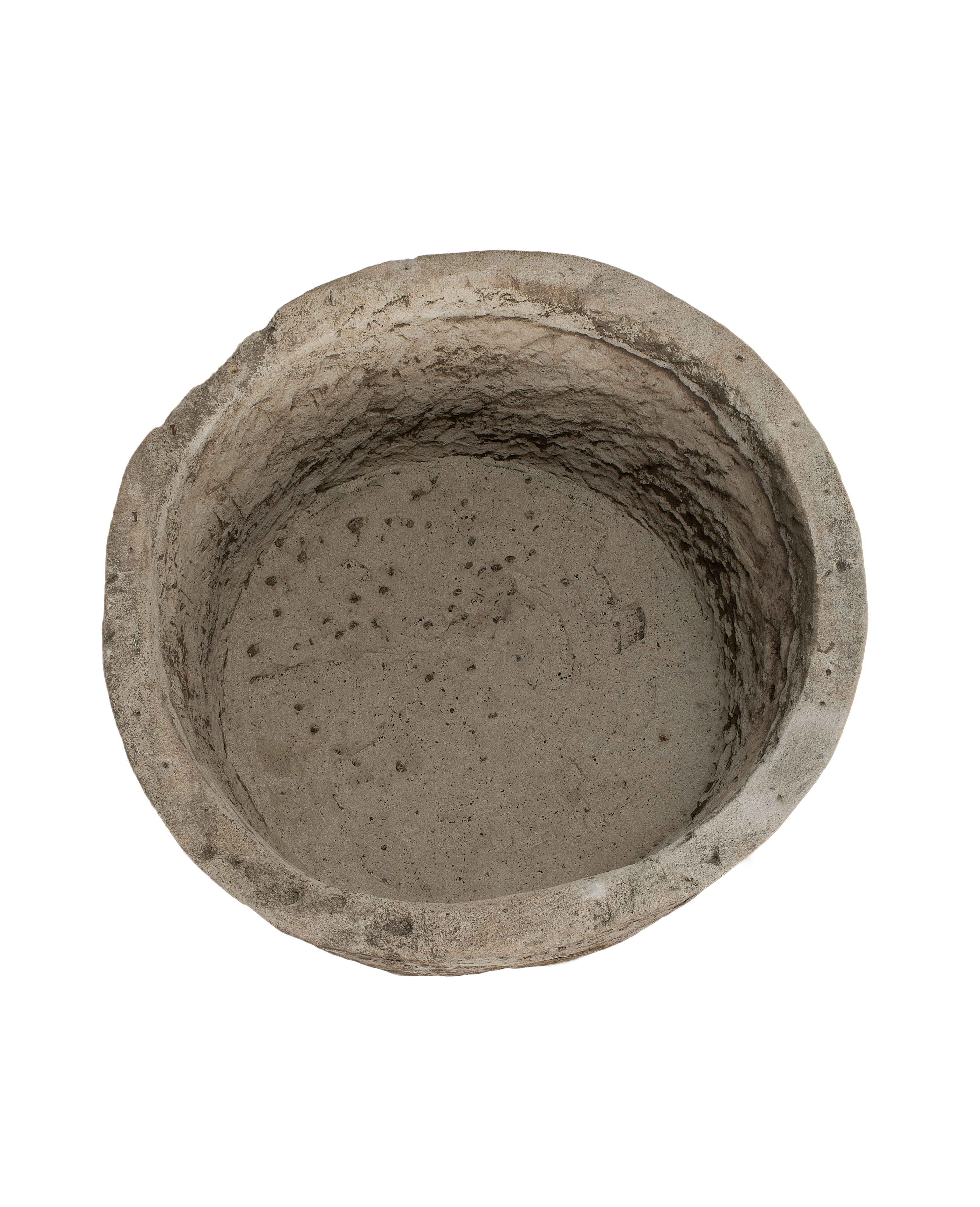Round vintage Indonesian limestone trough, showing textured interior and base from above.