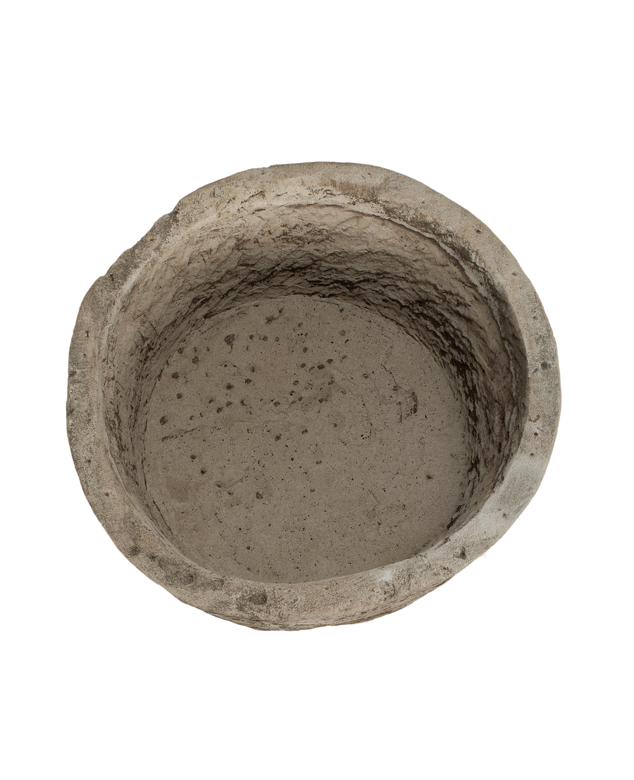 Round vintage Indonesian limestone trough, showing textured interior and base from above.