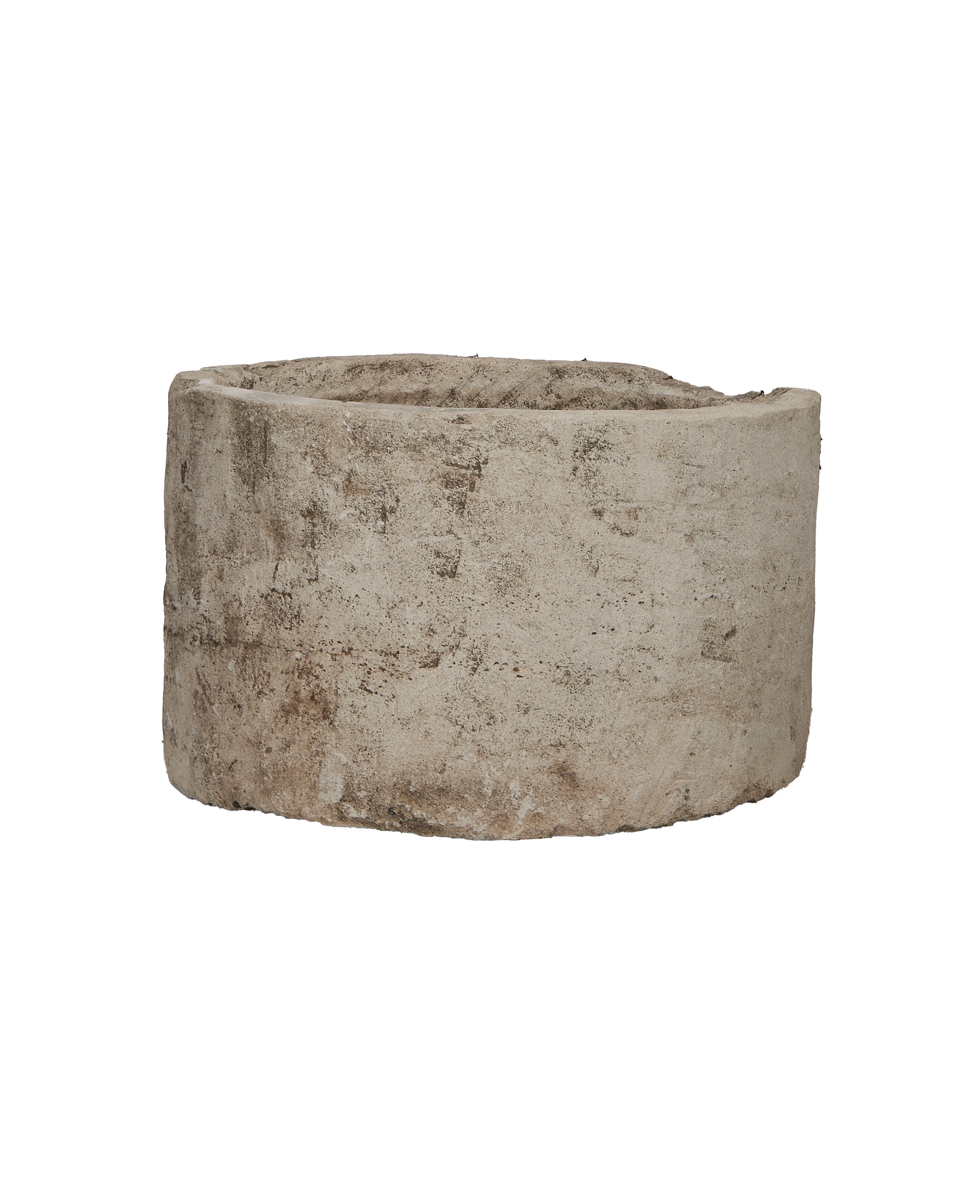 Vintage round Indonesian limestone trough, showing weathered texture and aged patina on its side.