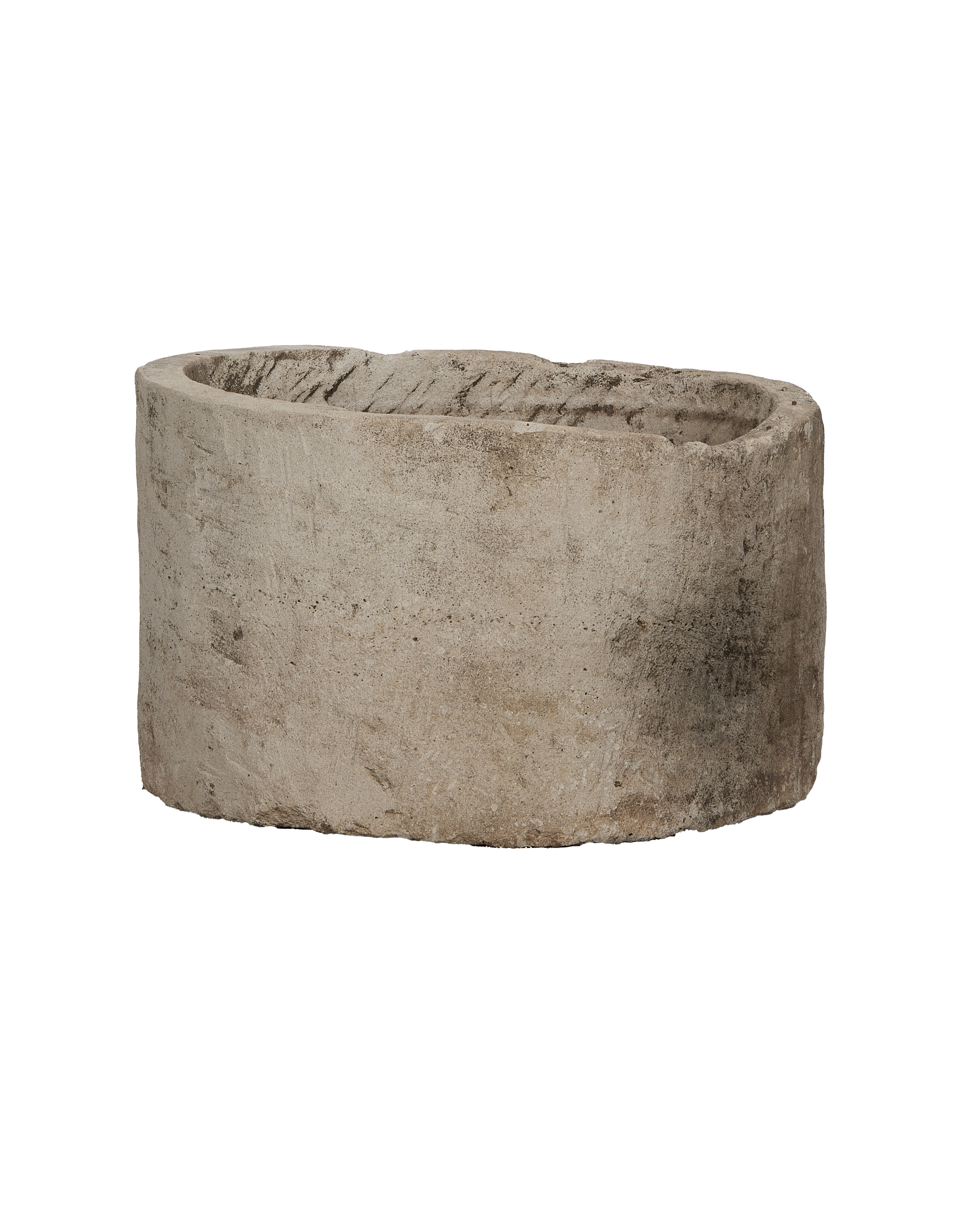 Vintage round Indonesian limestone trough, showing weathered texture from an elevated angle.