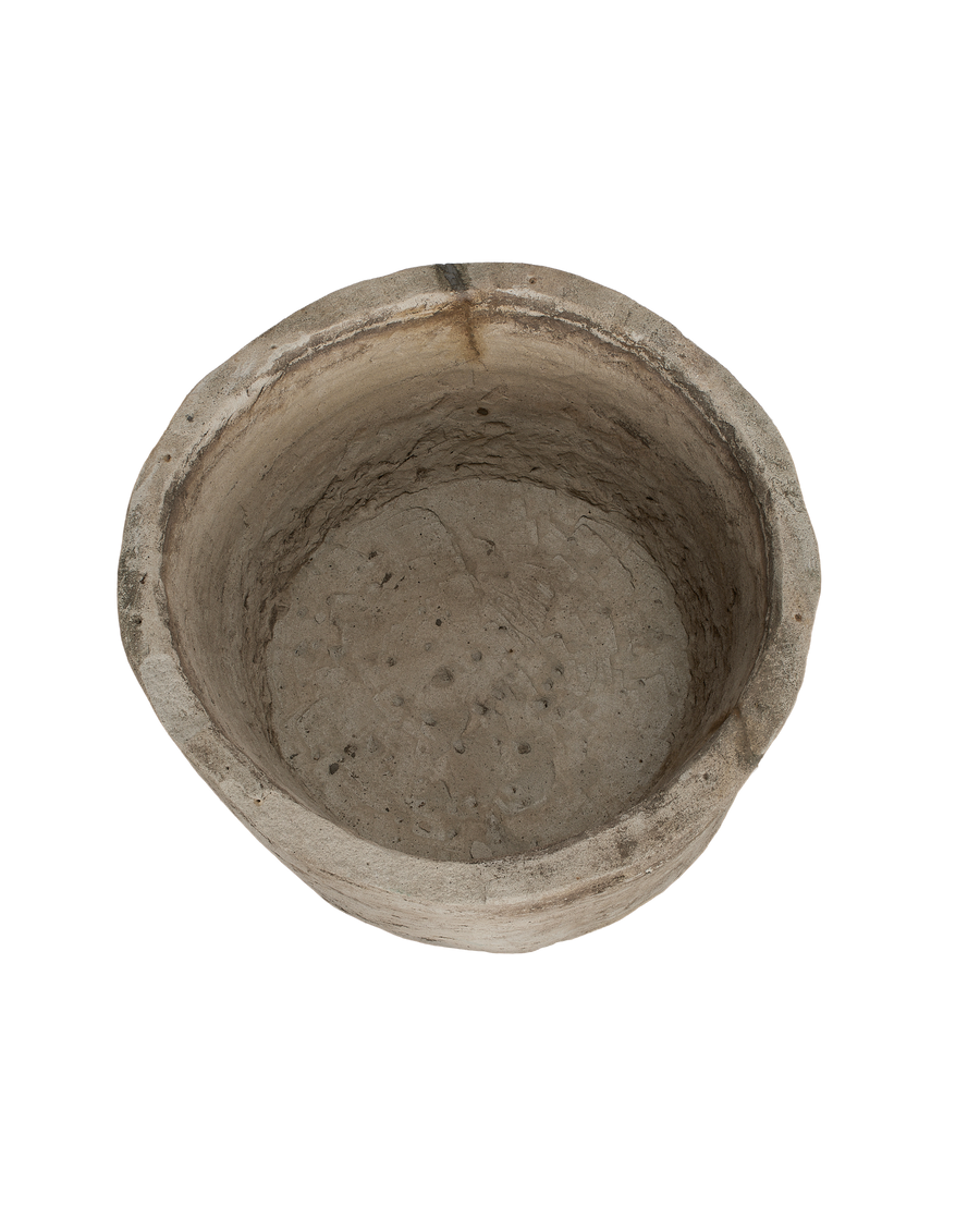 Vintage round Indonesian oak limestone trough, top view of weathered, textured interior.