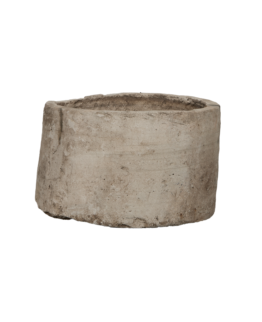 Vintage Indonesian limestone round trough, showcasing weathered texture and unique organic shape.