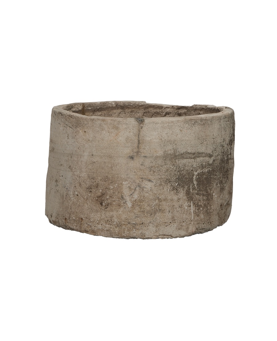 Vintage round Indonesian limestone trough, top-down view showing interior texture and rim.