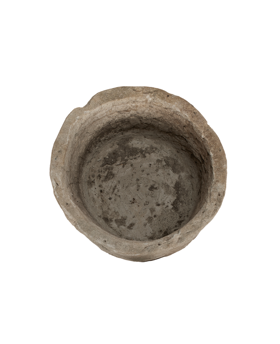 Vintage Indonesian limestone trough, top-down view showing weathered, pitted interior texture.