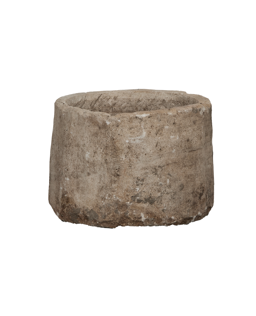 Vintage round limestone trough, Indonesia, showing rough exterior texture and thick walls.