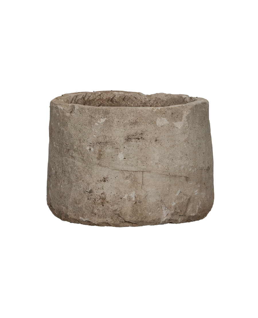 Vintage Indonesian round limestone trough, showing weathered texture and natural imperfections.
