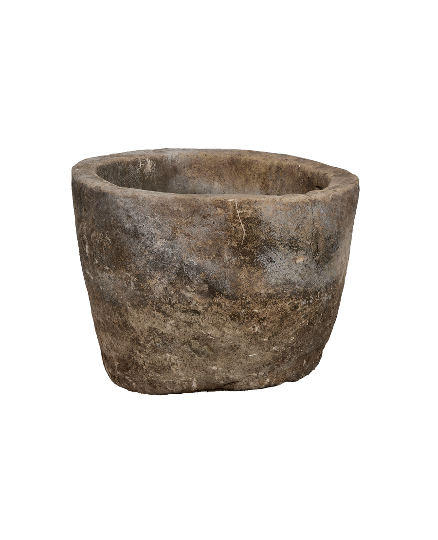 Vintage Indonesian round limestone trough, showing weathered texture and natural imperfections from above.