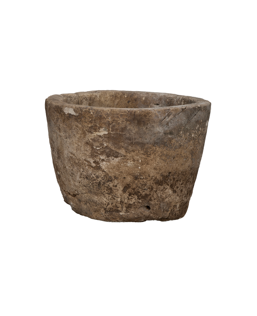 Vintage Indonesian limestone trough, displaying rugged texture and aged patination from slightly above.