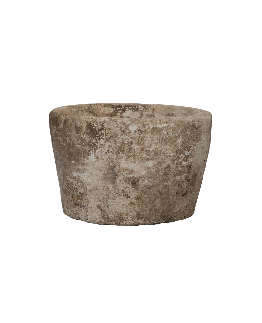 Vintage round Indonesian limestone trough, detailed view of textured surface and rim.